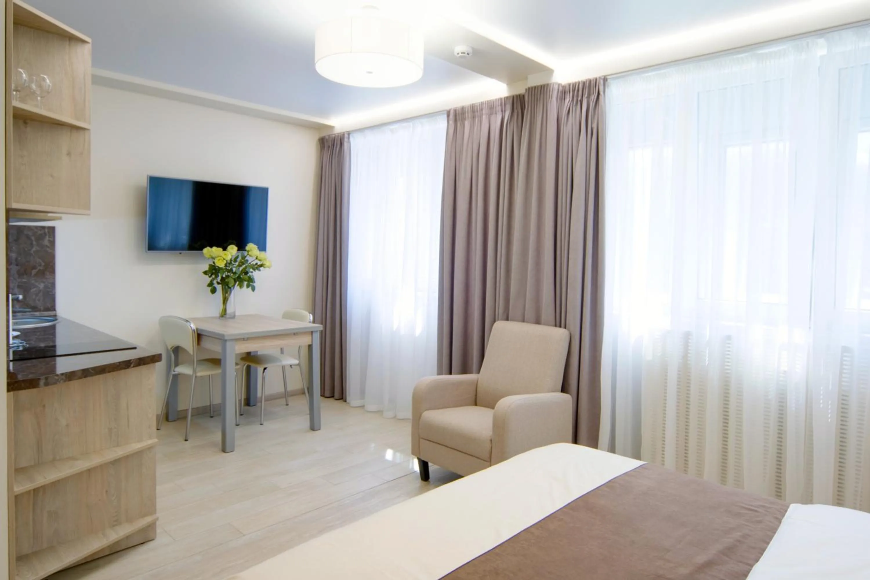 Communal lounge/ TV room, Bed in Arena Summit Apart Hotel