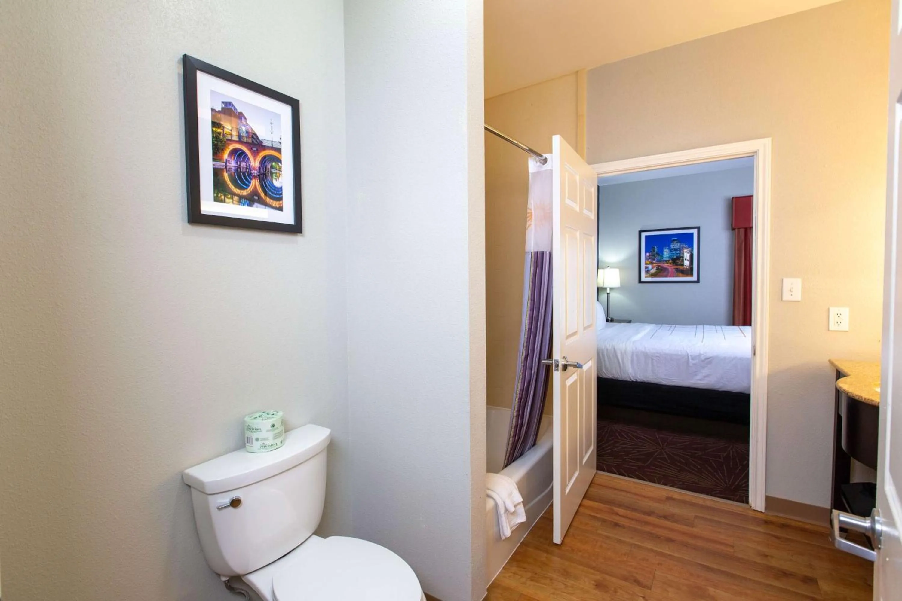 Toilet, Bed in La Quinta by Wyndham Houston East at Normandy