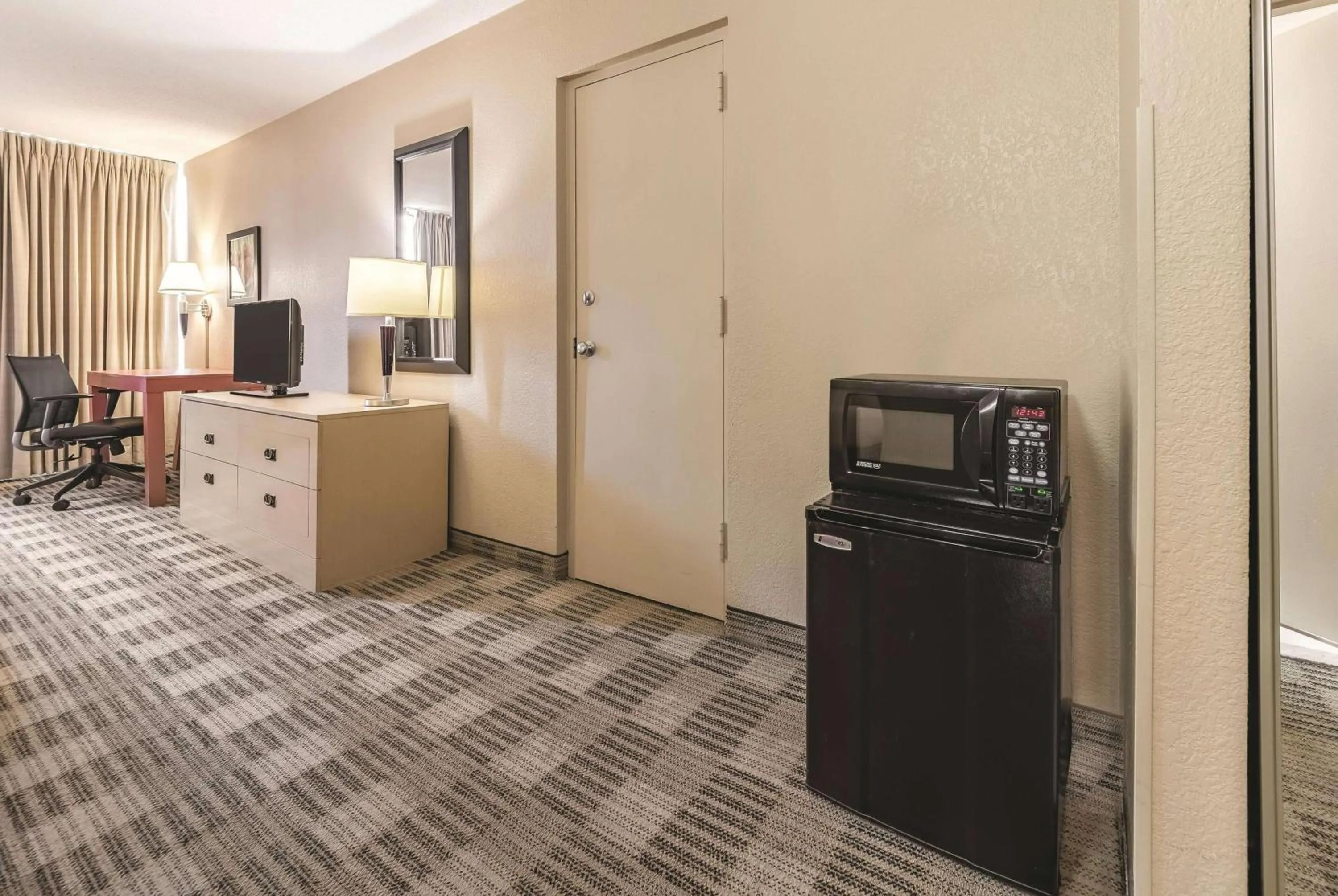 Photo of the whole room in Ramada Inn by Wyndham Fairfield NJ