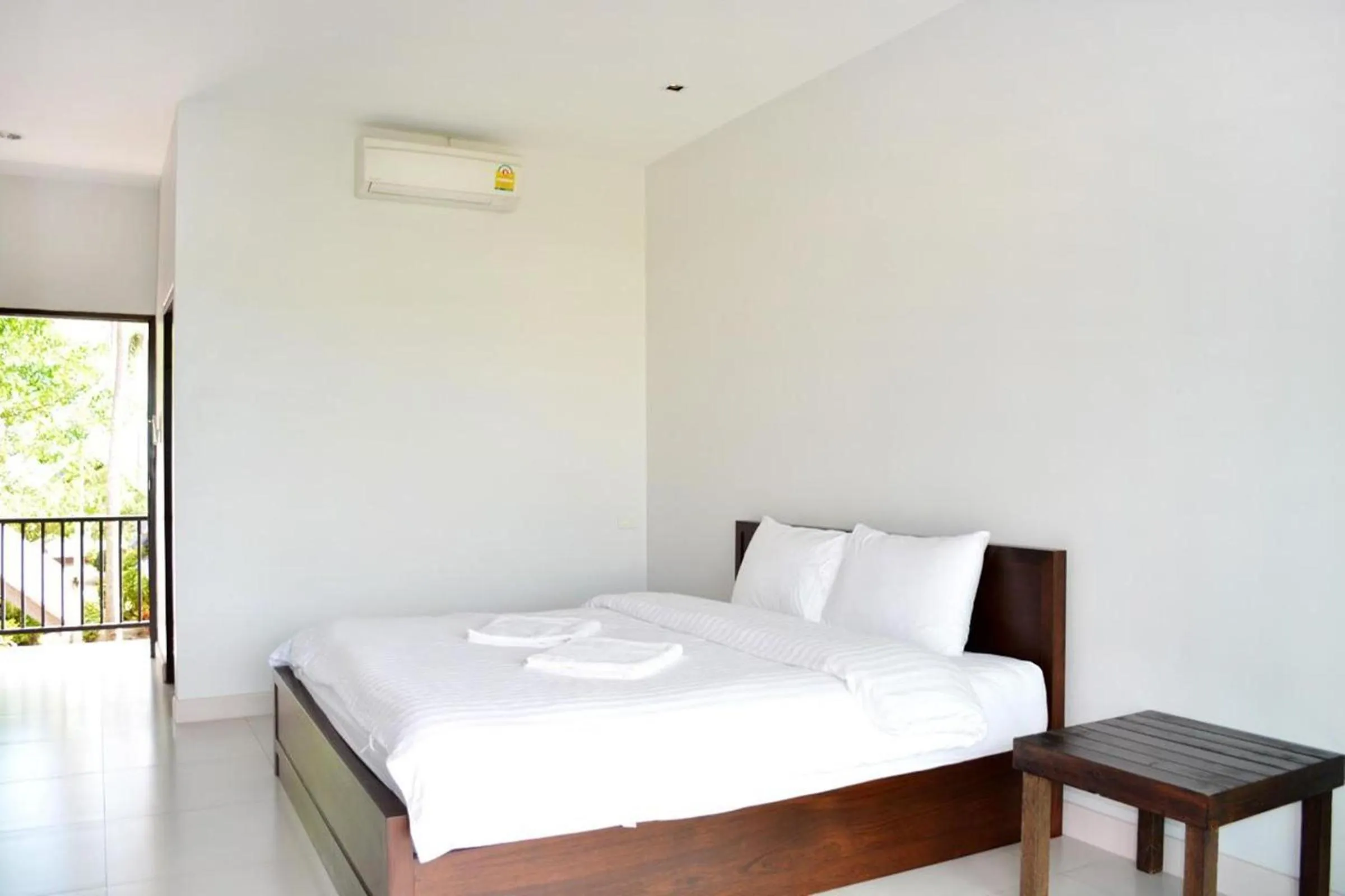 Bed in The Nidhra Boutique Resort