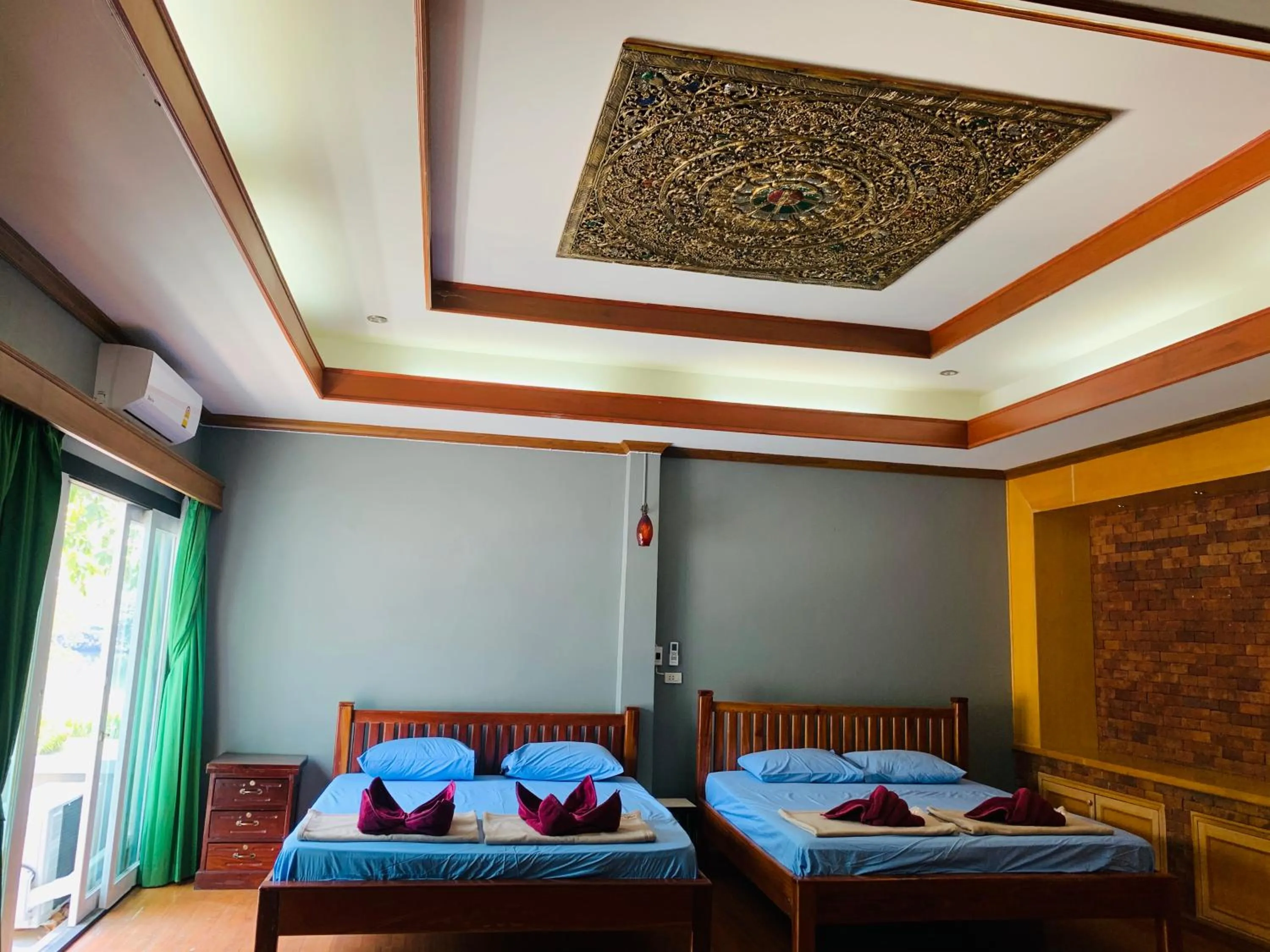 Photo of the whole room, Bed in Buasawan Resort & Restaurant