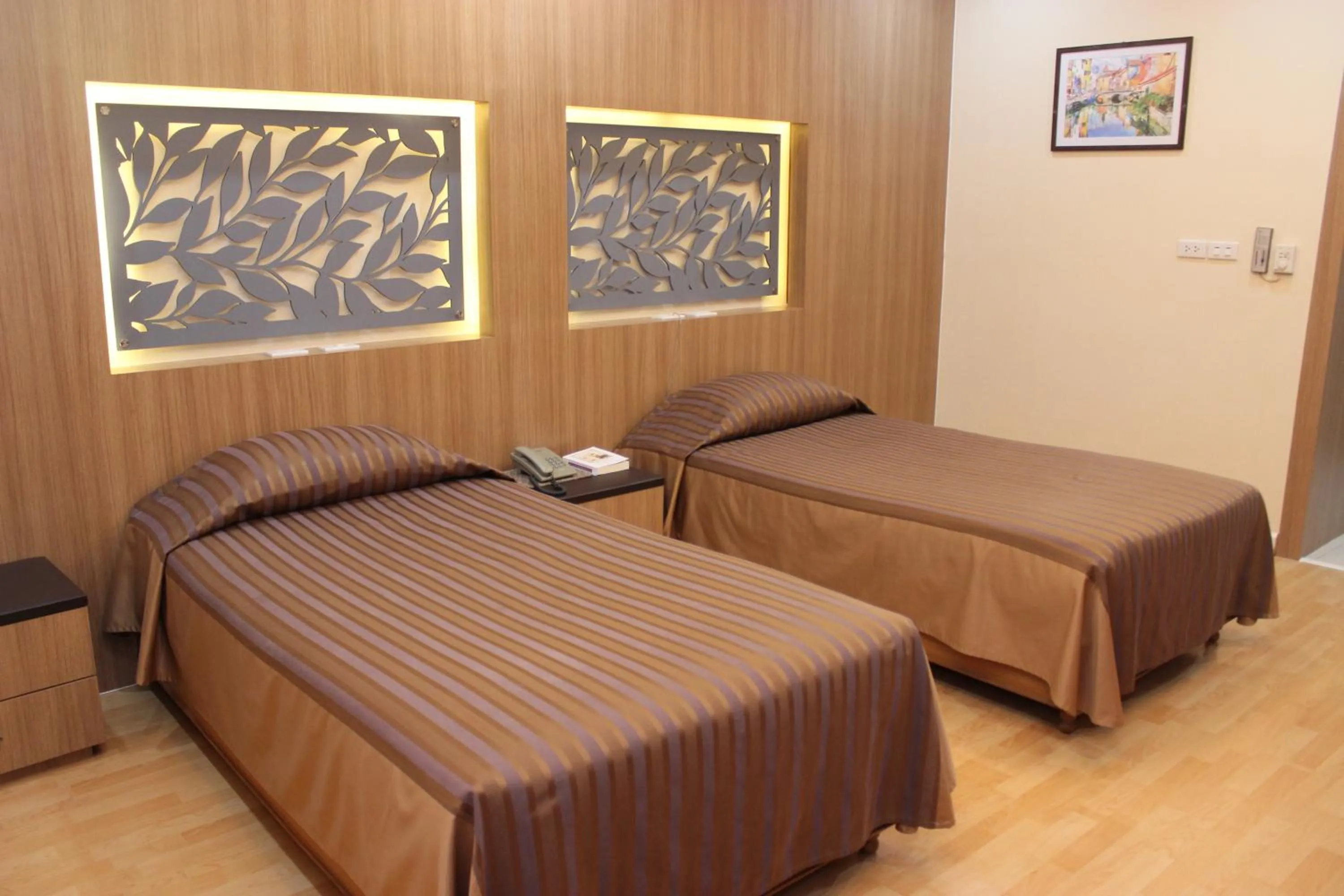 Bed in Charoen Hotel