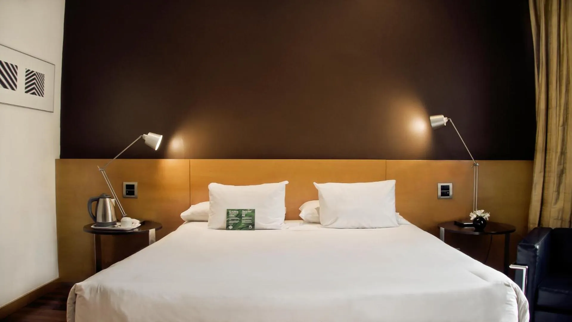 Bed in 725 Continental Hotel