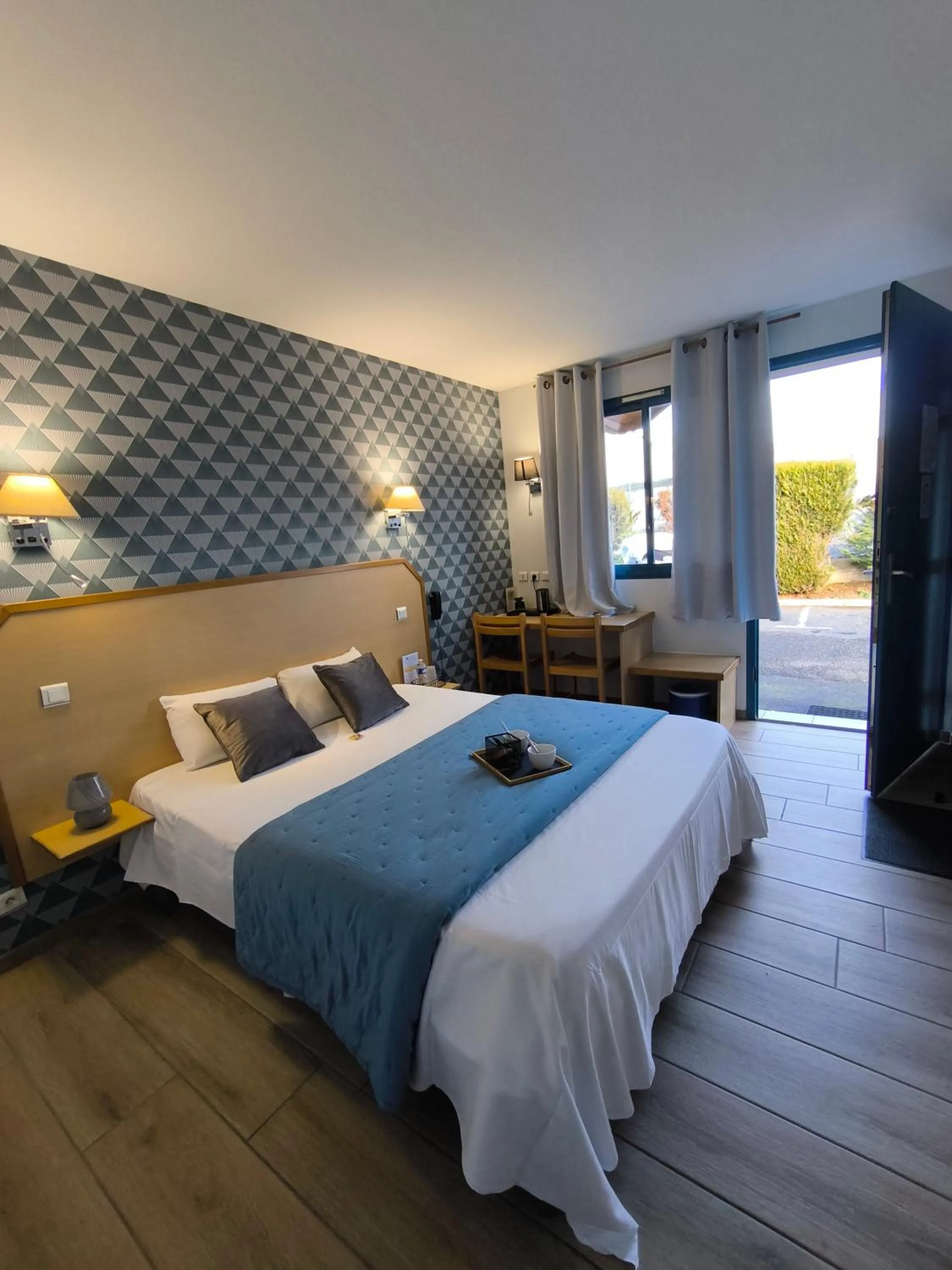 Bedroom, Bed in Hôtel Le Laury's-hôtel calme proche de Rodez avec parking privé gratuit