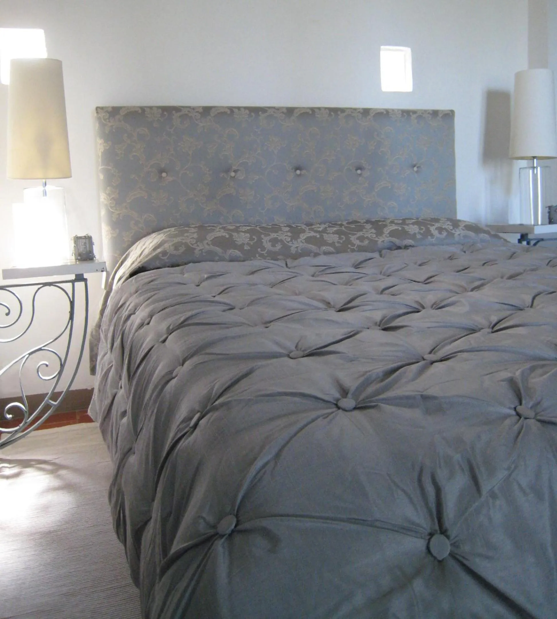 Bed in Fontelunga Hotel & Villas