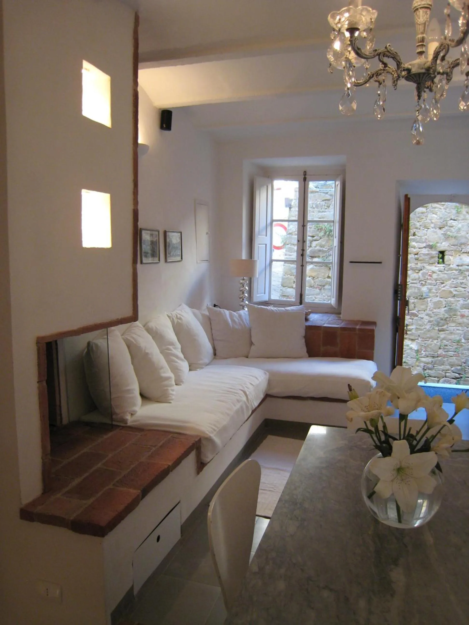 Communal lounge/ TV room, Bed in Fontelunga Hotel & Villas