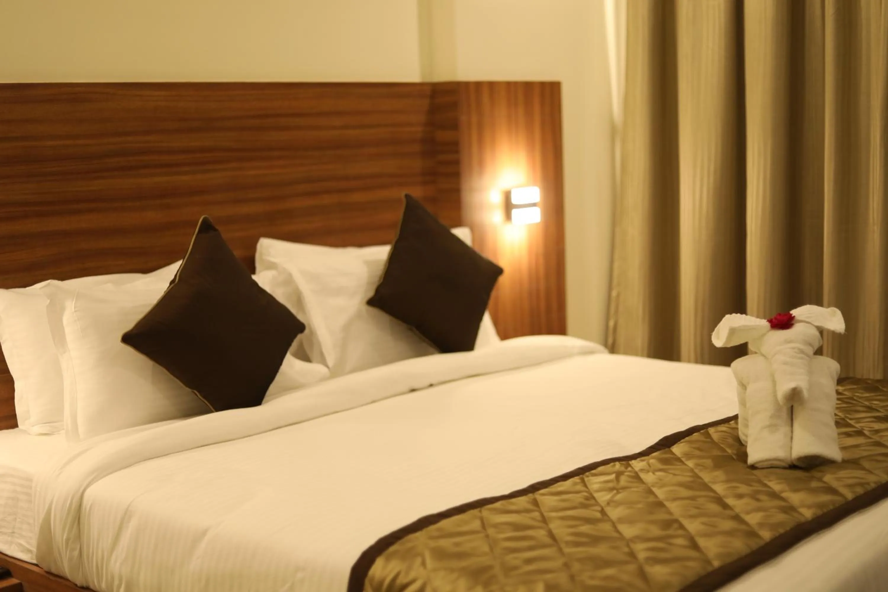 Bed in Kyriad Hotel Solapur by OTHPL