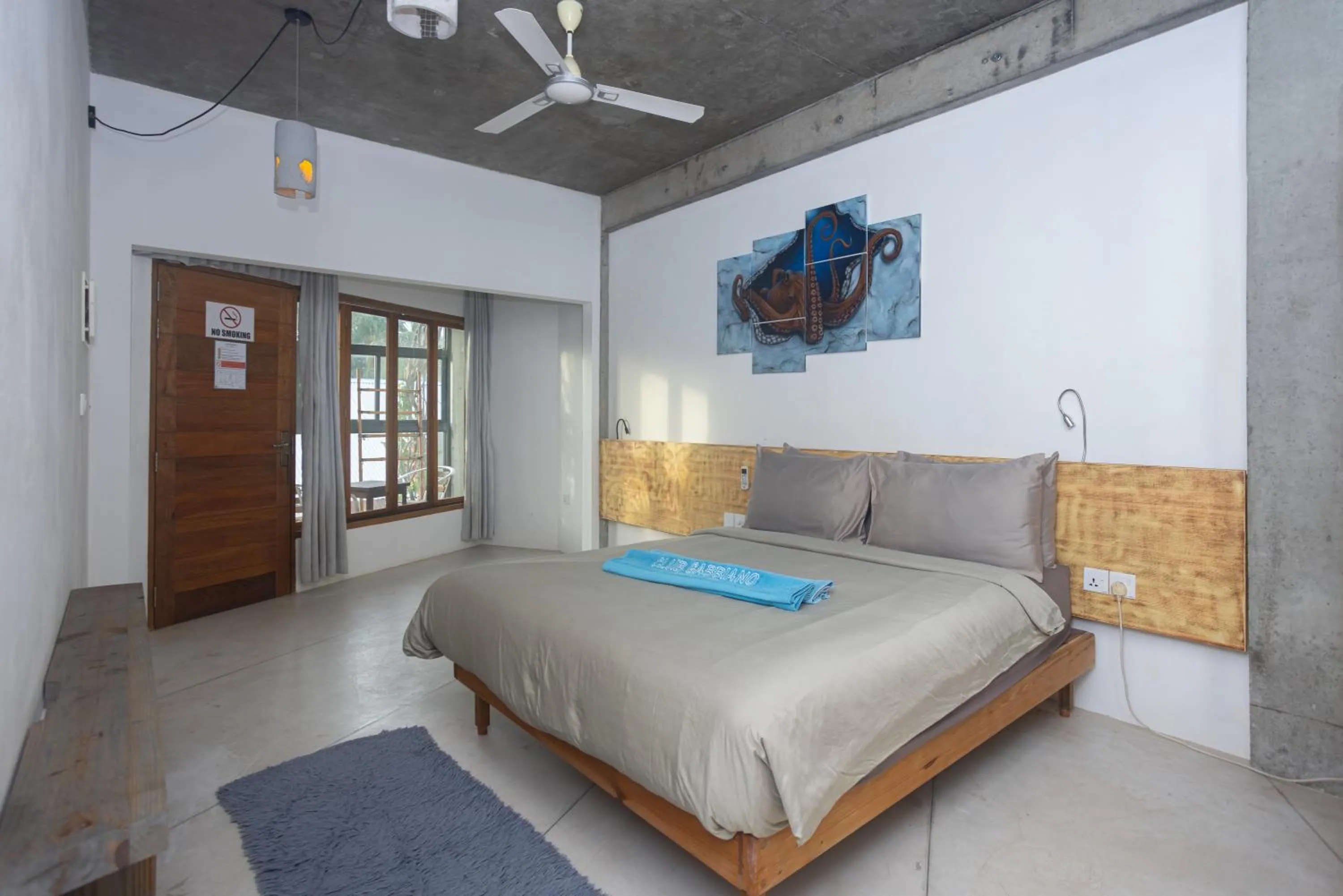 Seating area, Bed in Club Gabbiano