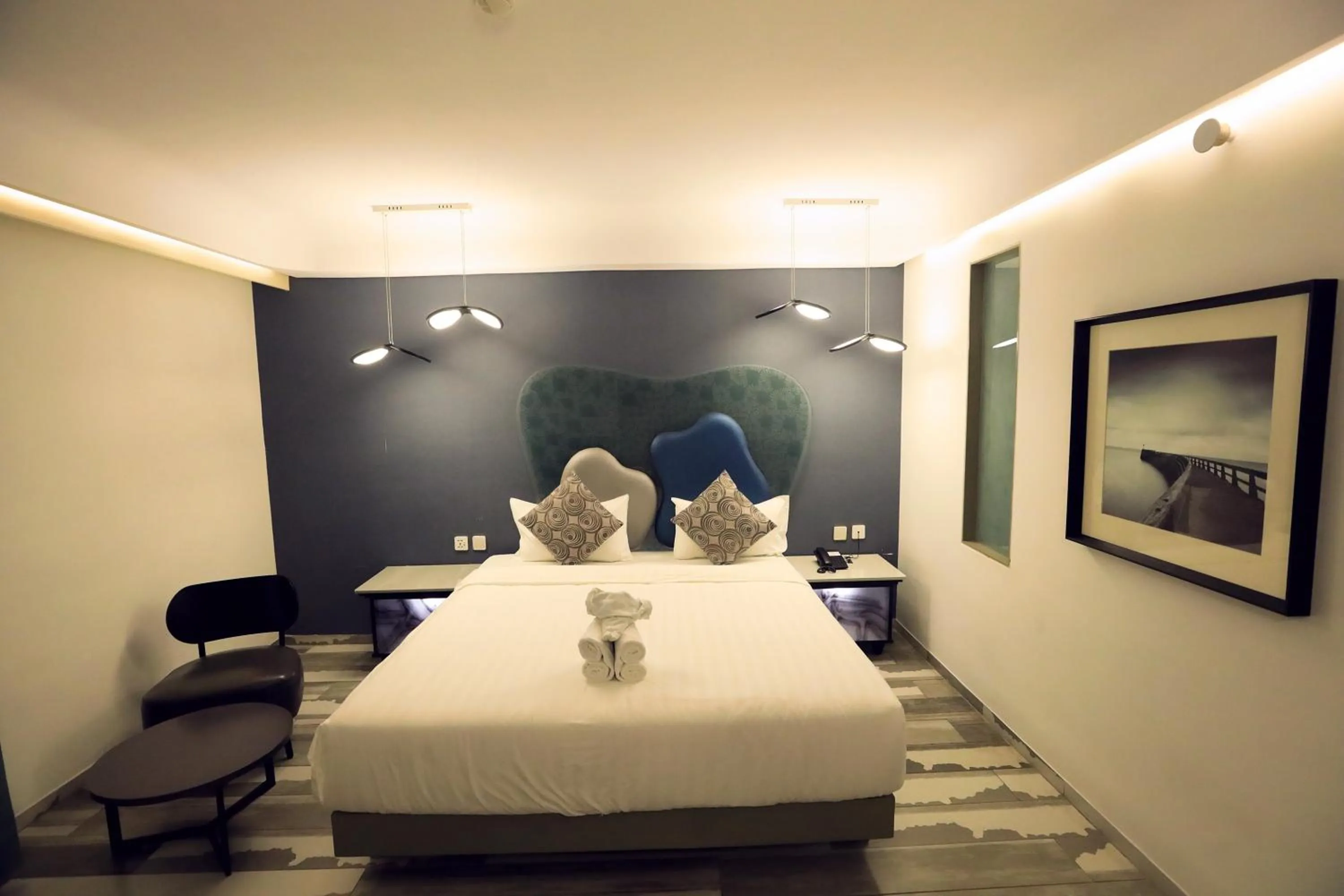 Bed in Humming Bird Hotel & Banquet