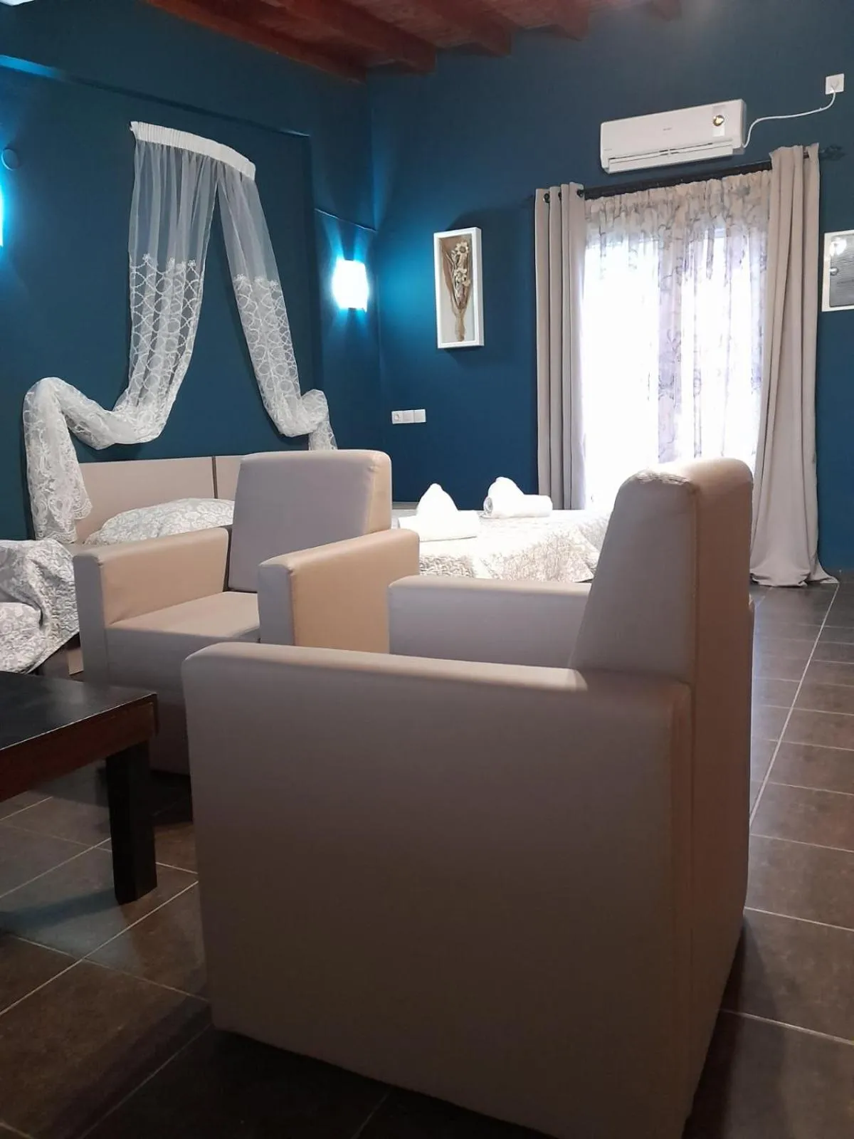 Bed in Victory Apartments Hotel