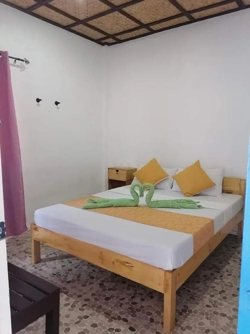 Bed in Mecaja Beach House