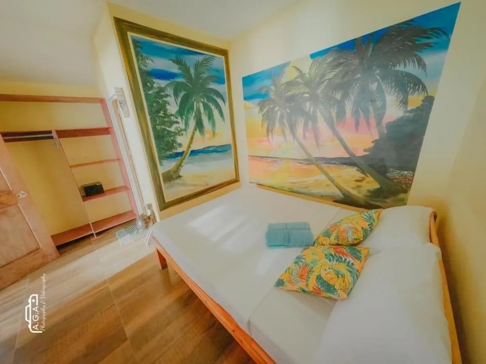 Bed in Mecaja Beach House