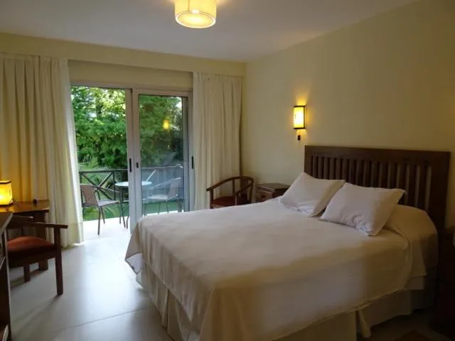 Bed in Petit Chateau Hotel Boutique