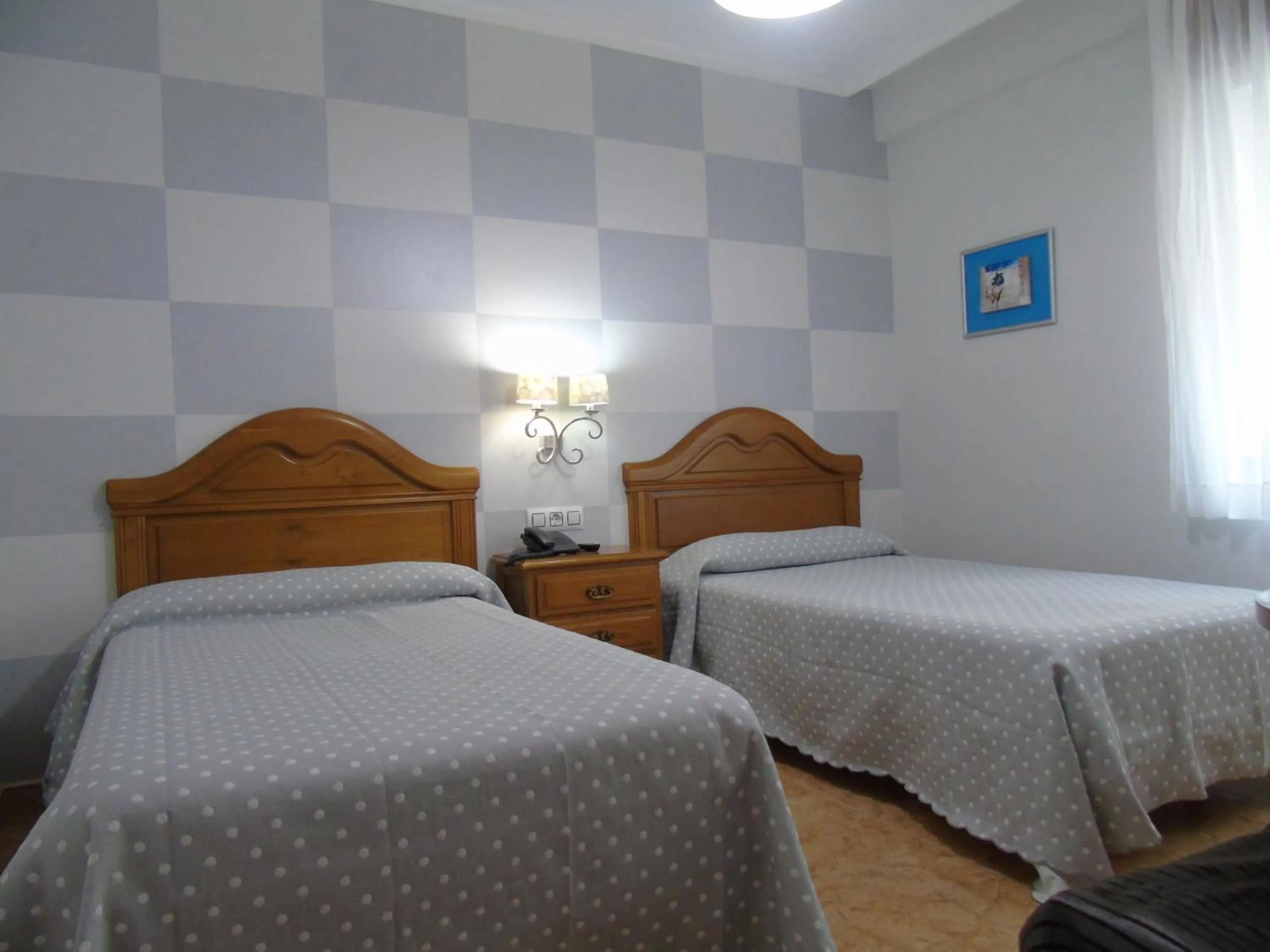 Bed in Hotel Bruselas