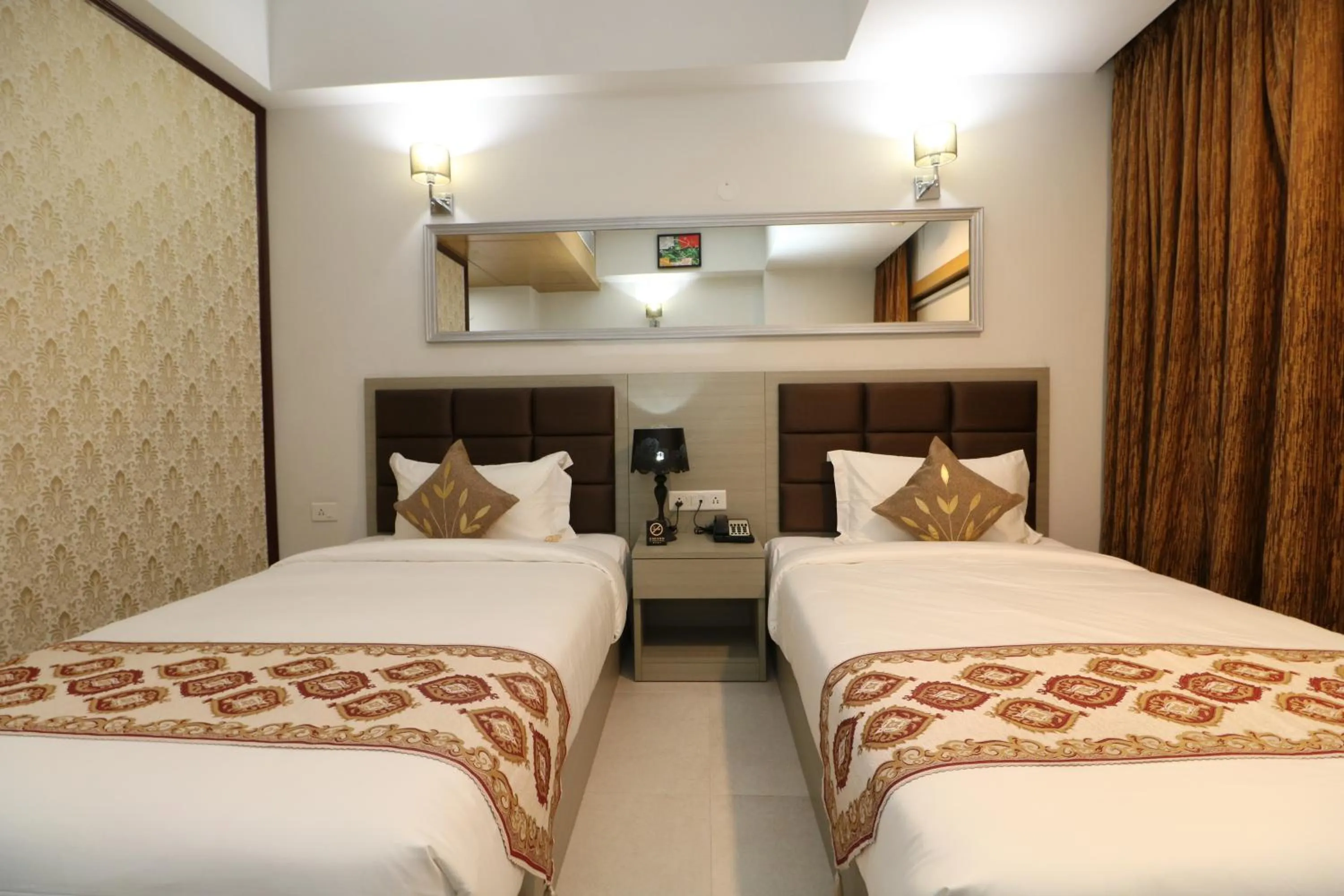 Bed in Aristocrat Hotel, New Town, Kolkata