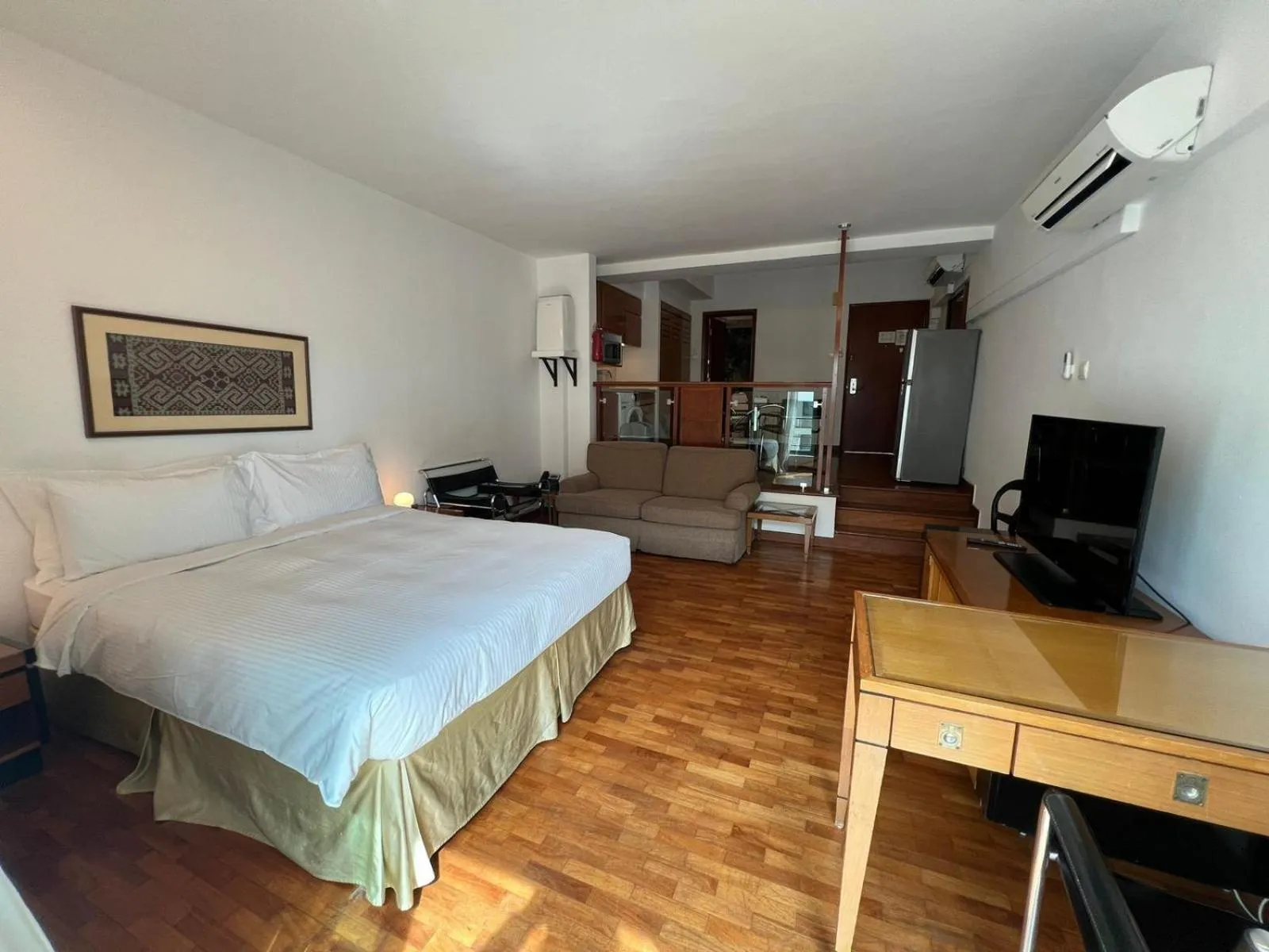 Photo of the whole room, Bed in Orchard Point Serviced Apartments