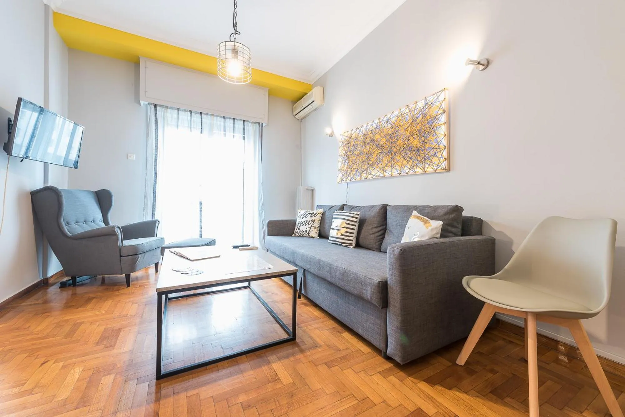 Living room in Athens Boutique Apartment by Cloudkeys