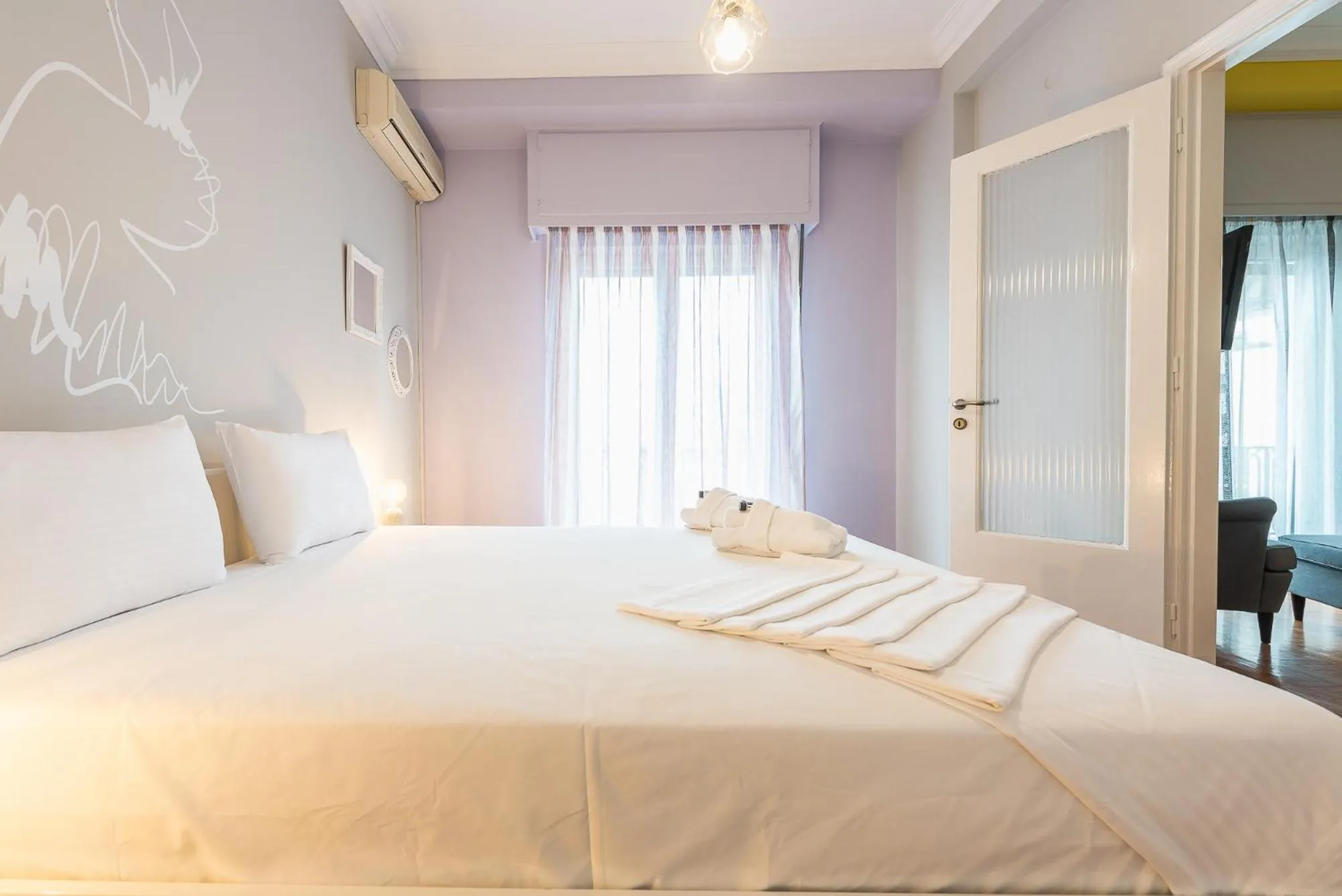 Bed in Athens Boutique Apartment by Cloudkeys