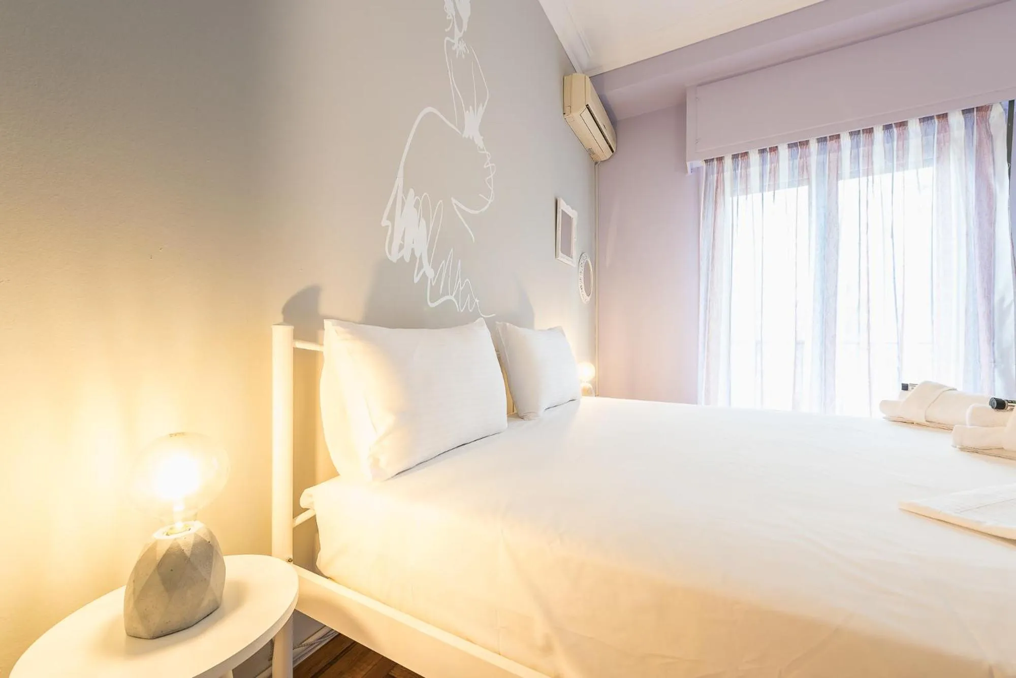 Bed in Athens Boutique Apartment by Cloudkeys