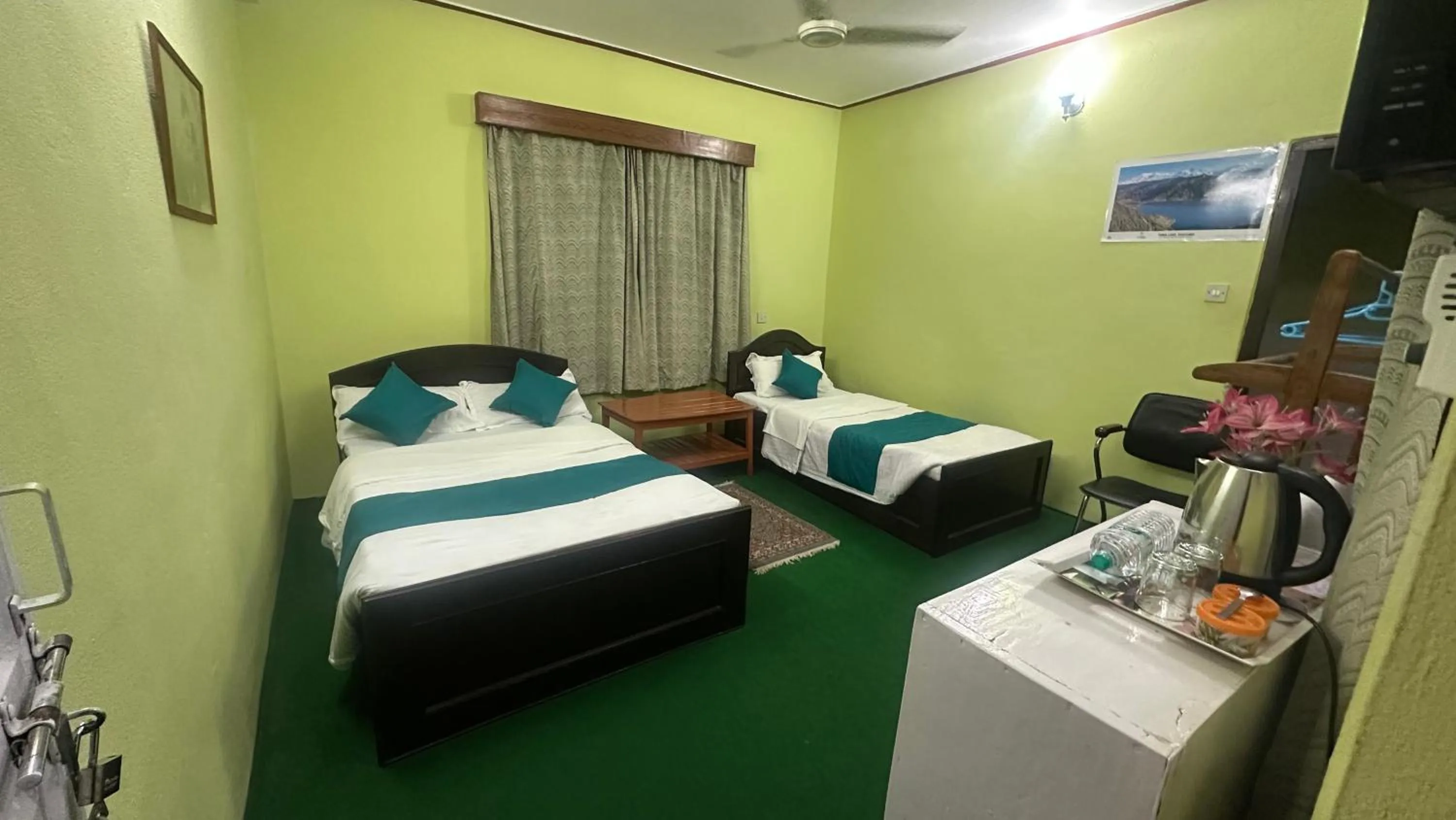 Photo of the whole room, Bed in New Pokhara Lodge - Pokhara Lakeside