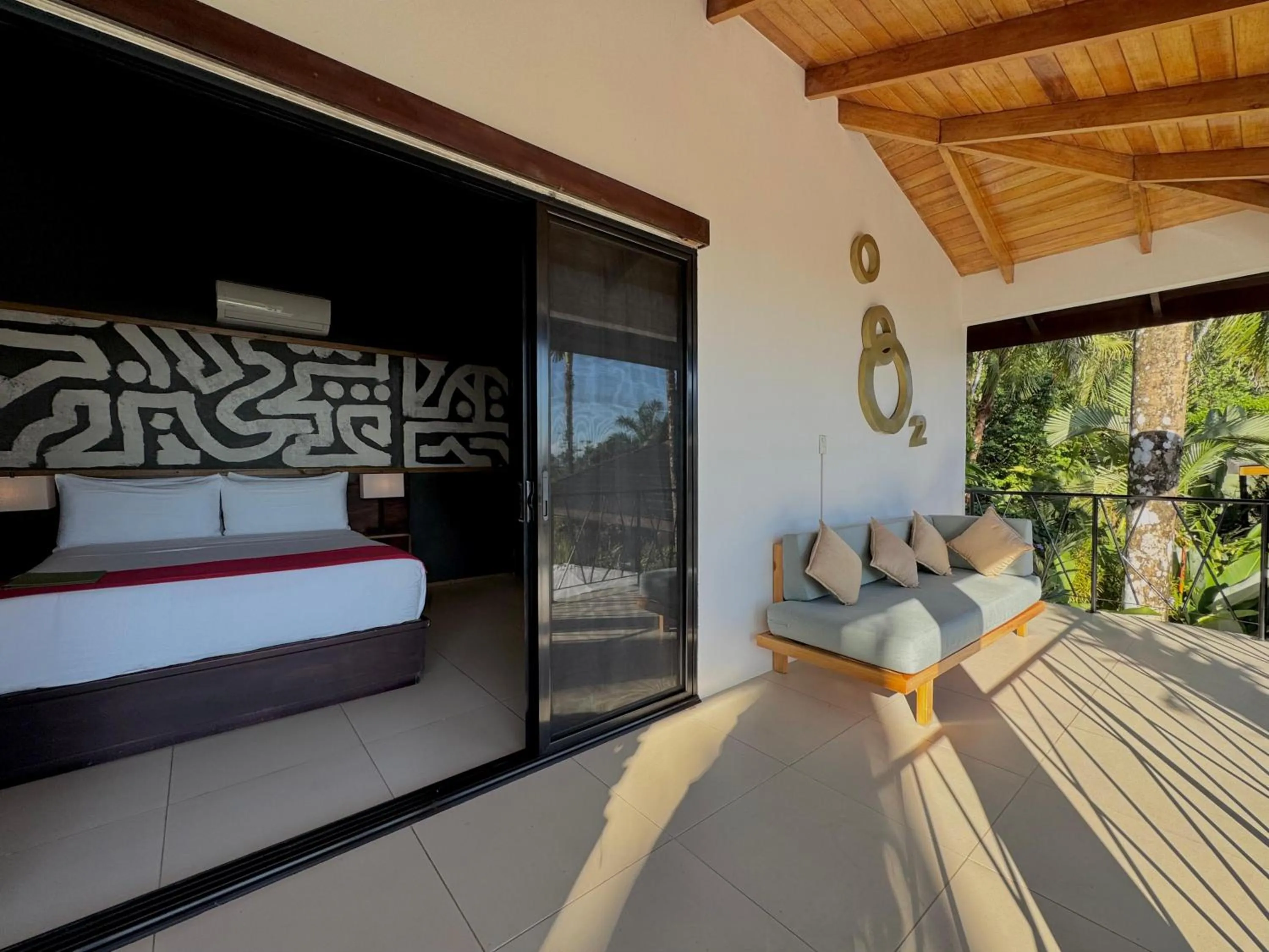 Seating area, Bed in Oxygen Jungle Villas & Spa