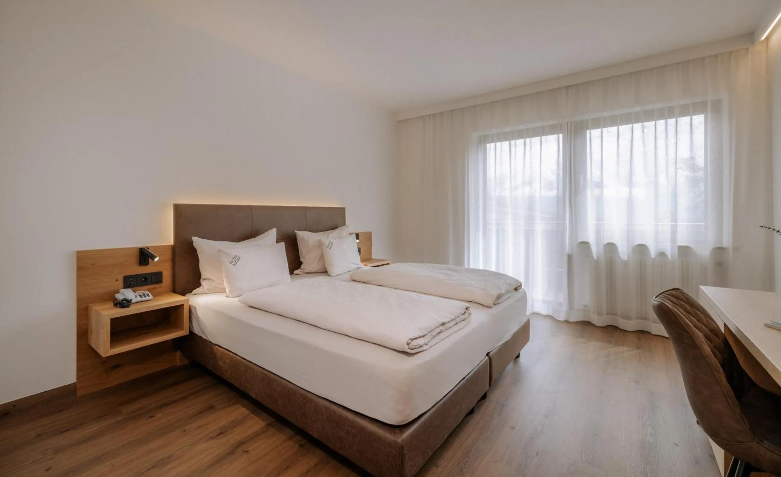 Bed in Garni-Hotel Farmerhof
