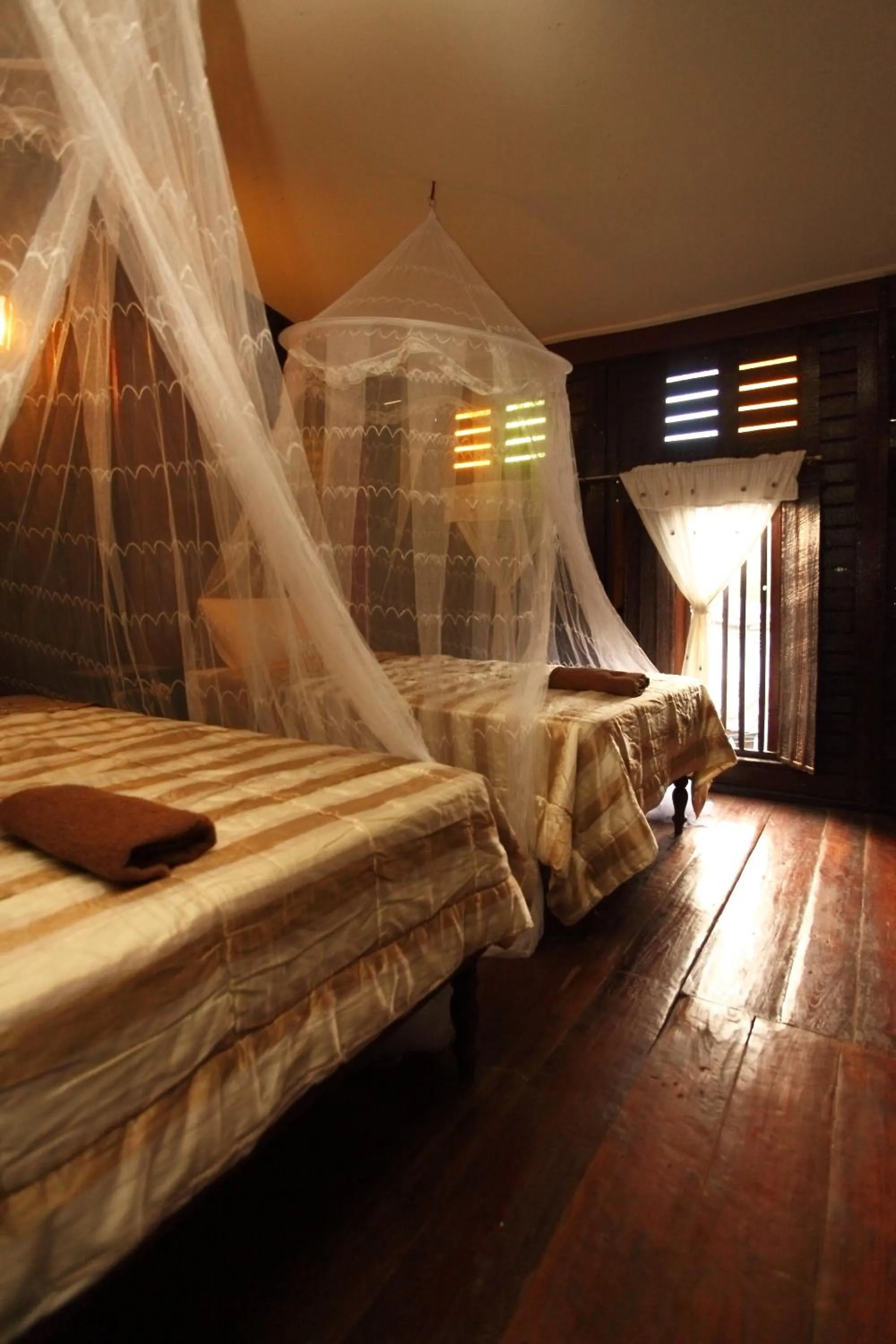 Bed in Baan Are Gong Riverside Homestay
