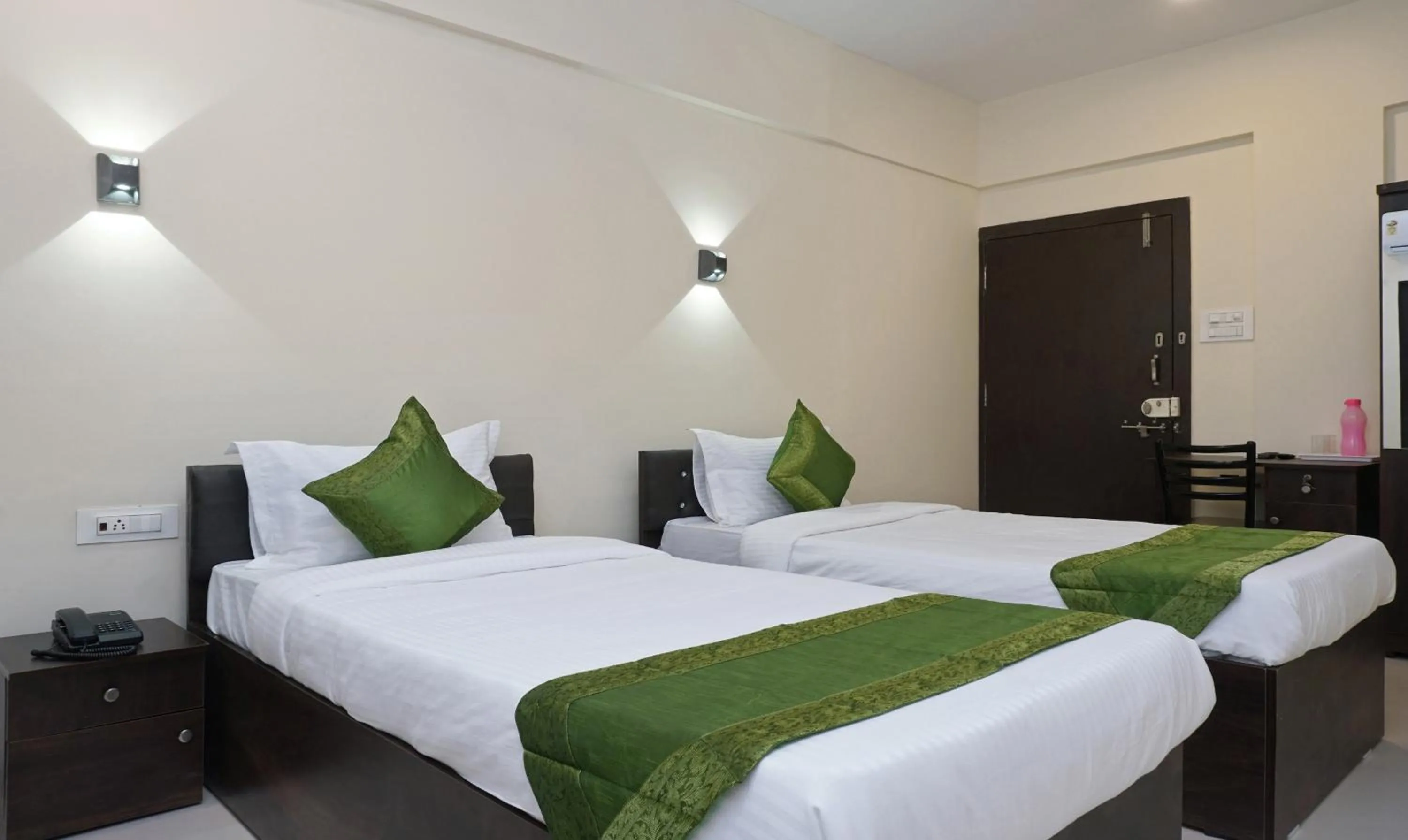 Bedroom, Bed in Treebo Lotus Baner