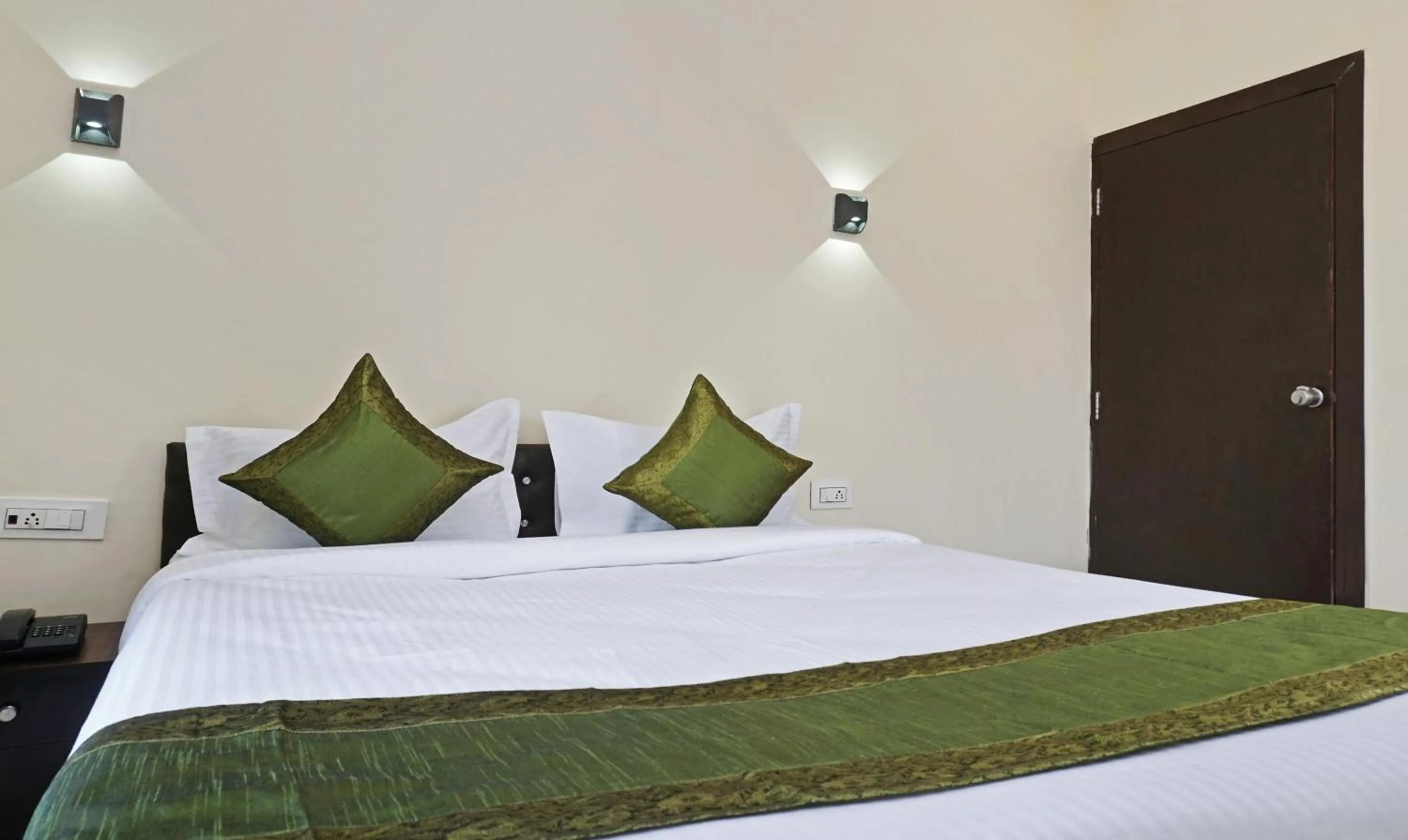 Bedroom, Bed in Treebo Lotus Baner