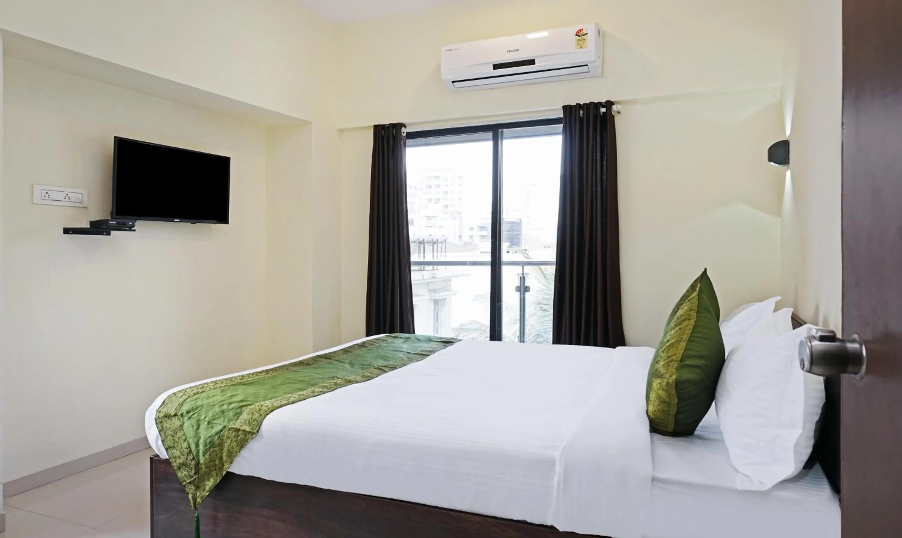 Bedroom, Bed in Treebo Lotus Baner