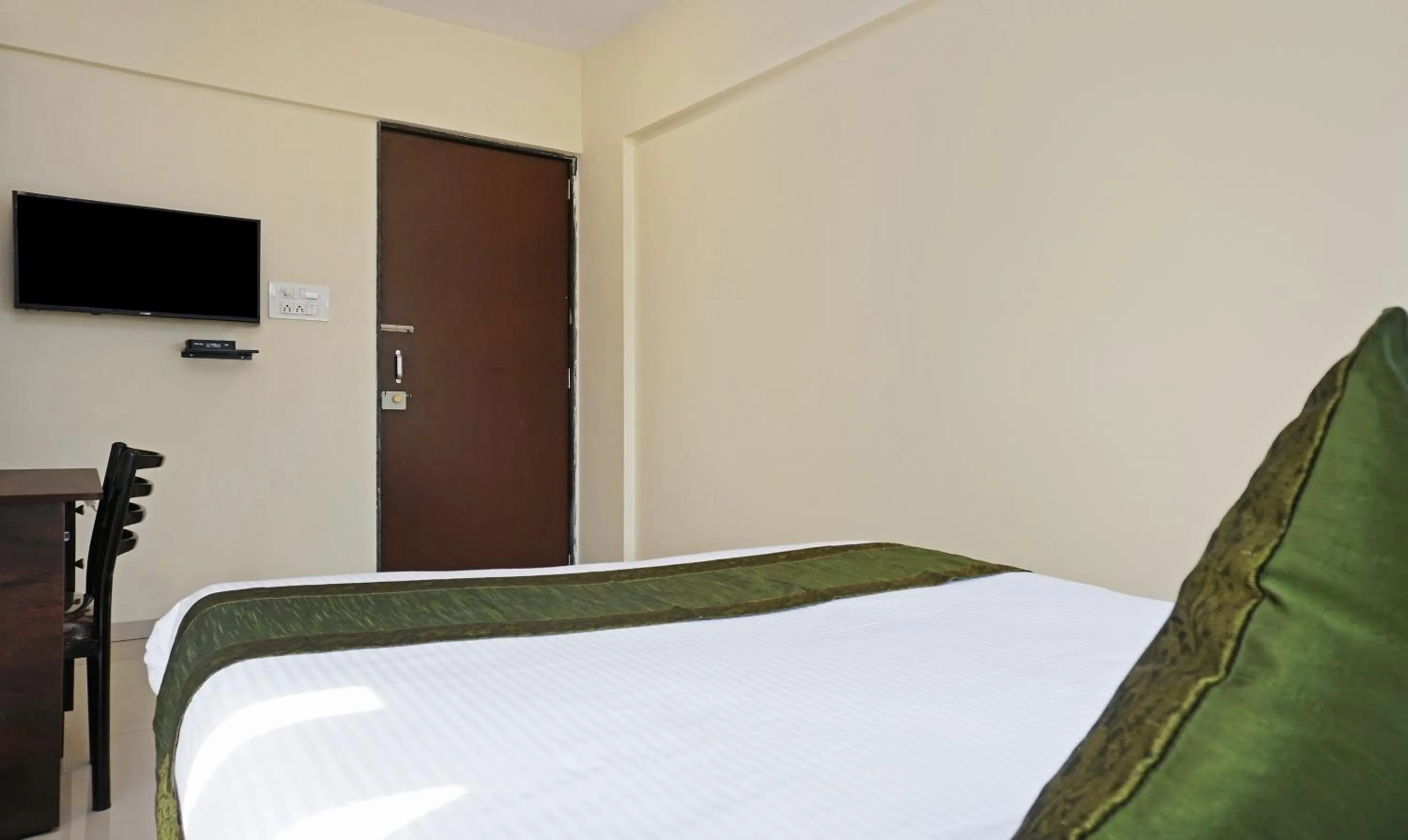 Bedroom, Bed in Treebo Lotus Baner