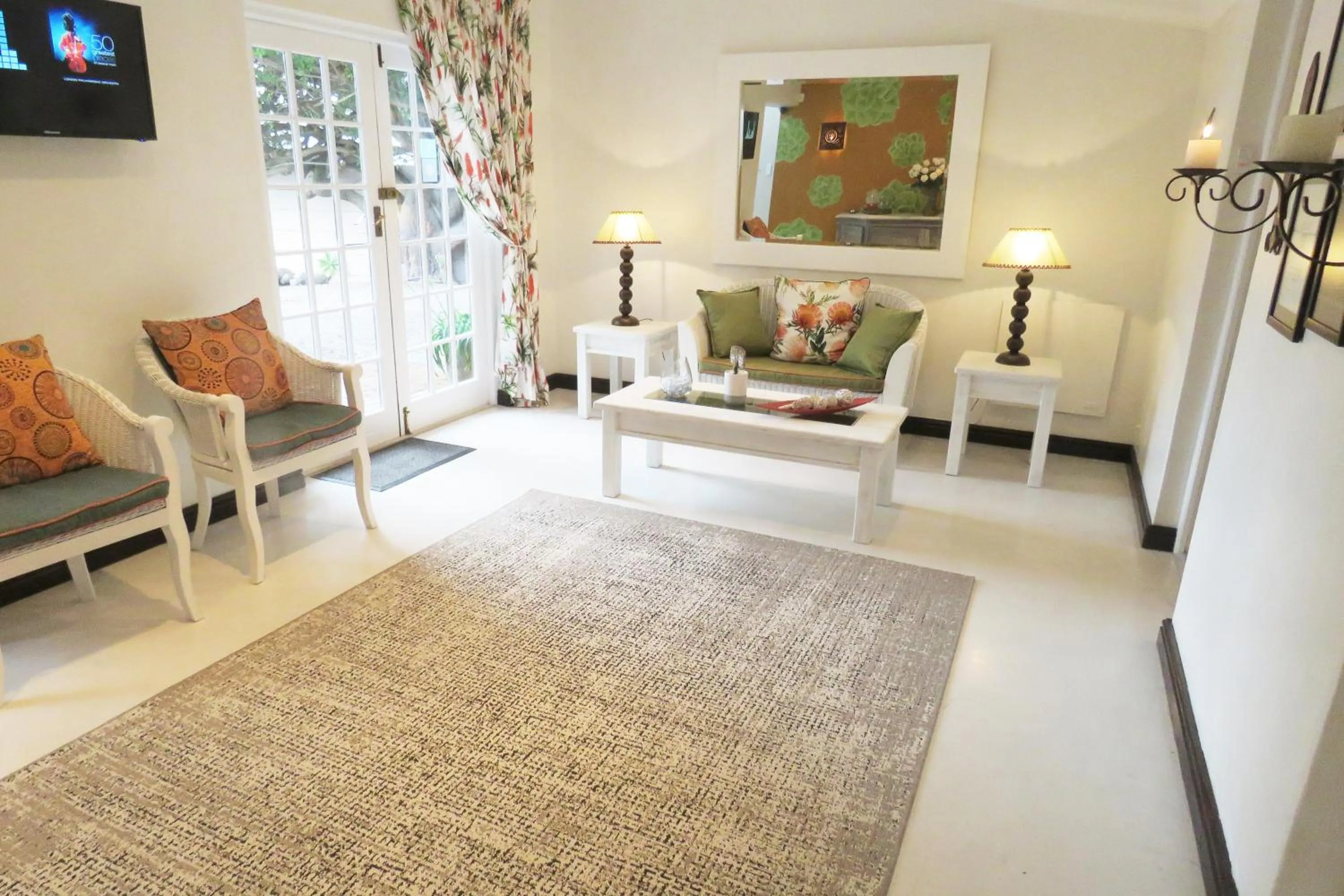 Communal lounge/ TV room in The Potting Shed Guest House