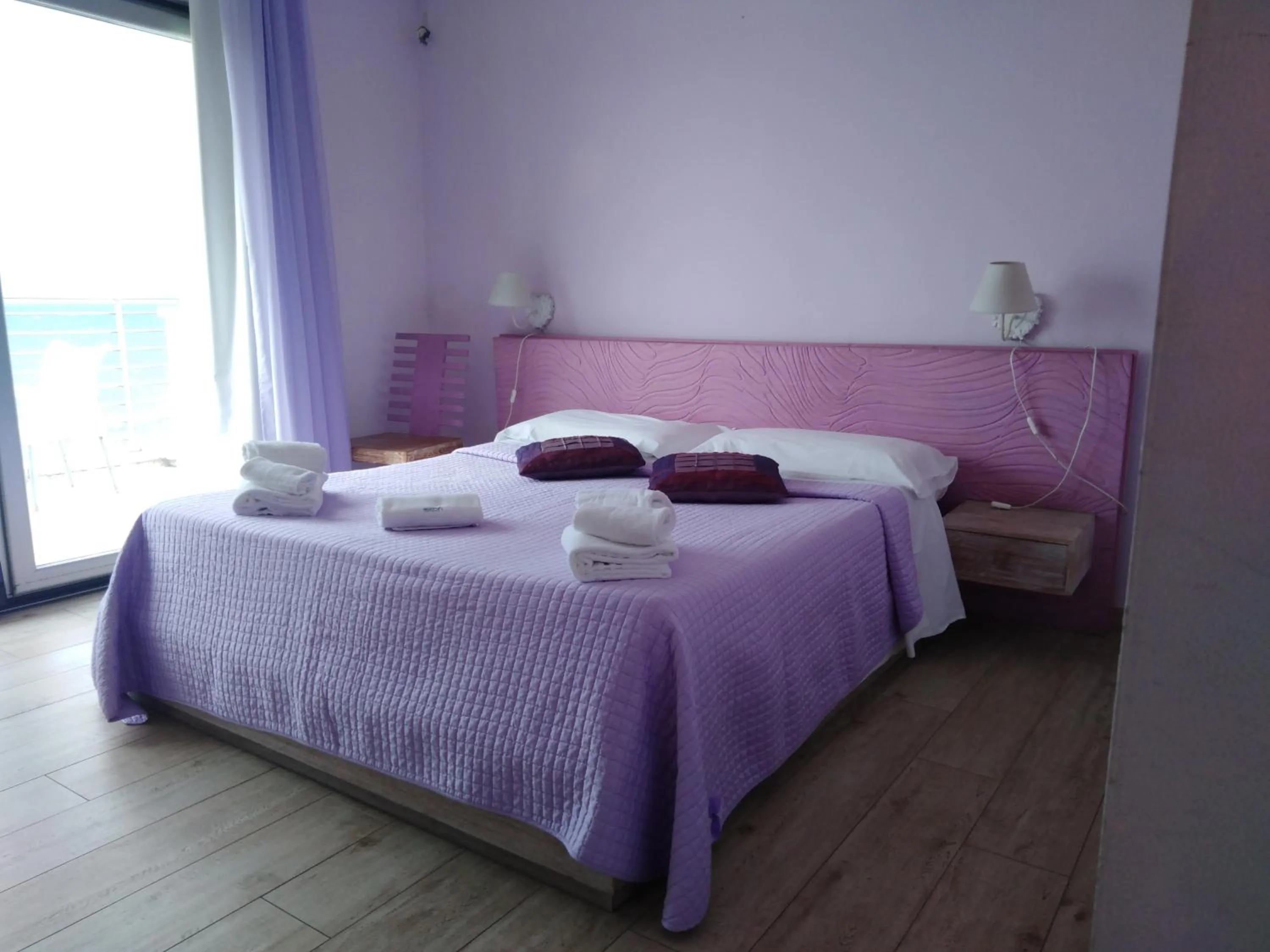 Bed in La Rosa dei Venti Resort