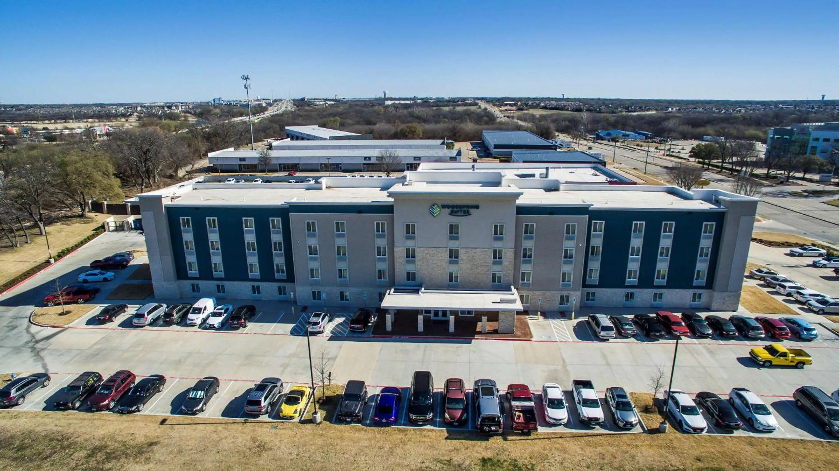 Property building in WoodSpring Suites Dallas Plano Central Legacy Drive