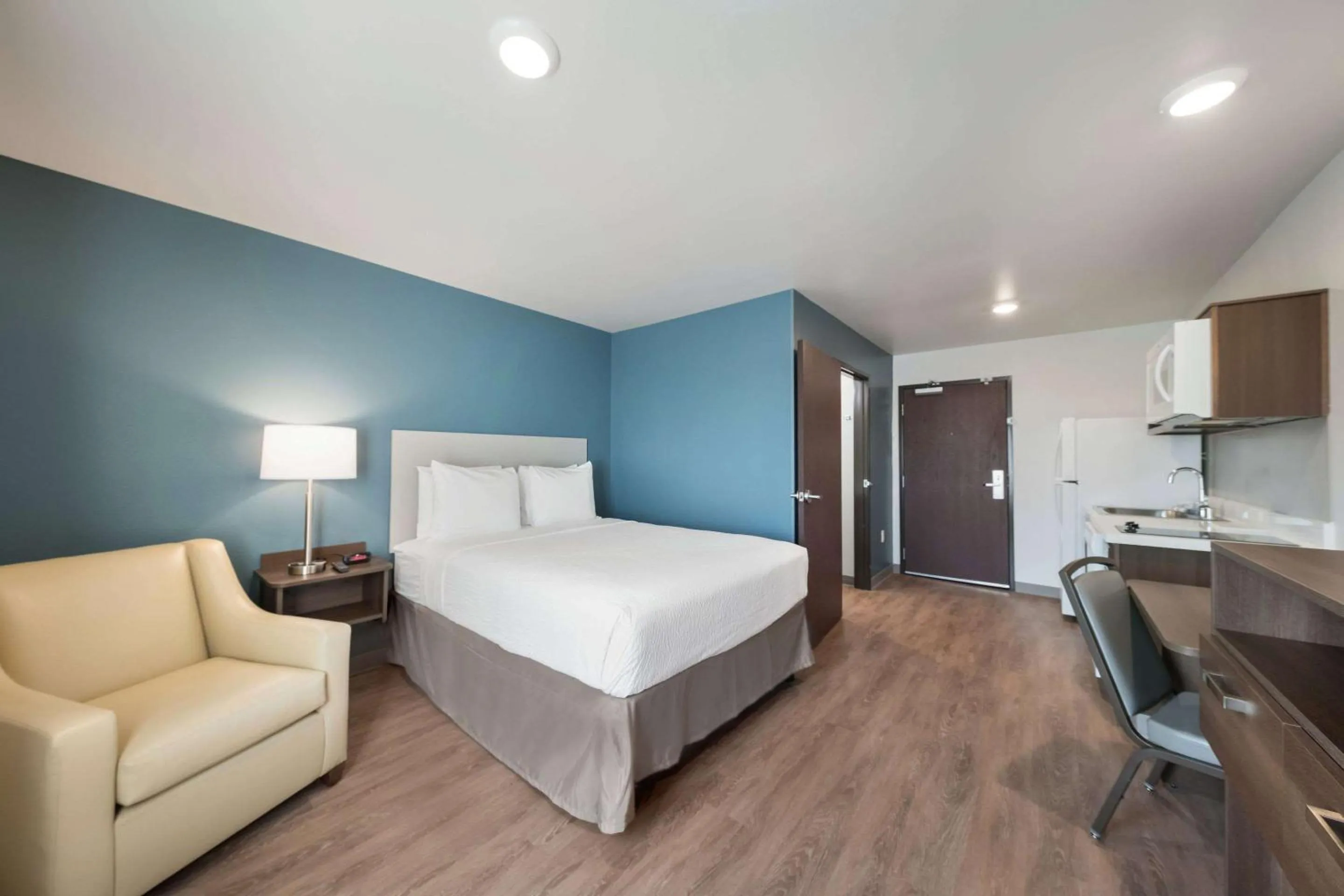 Photo of the whole room, Bed in WoodSpring Suites Dallas Plano Central Legacy Drive
