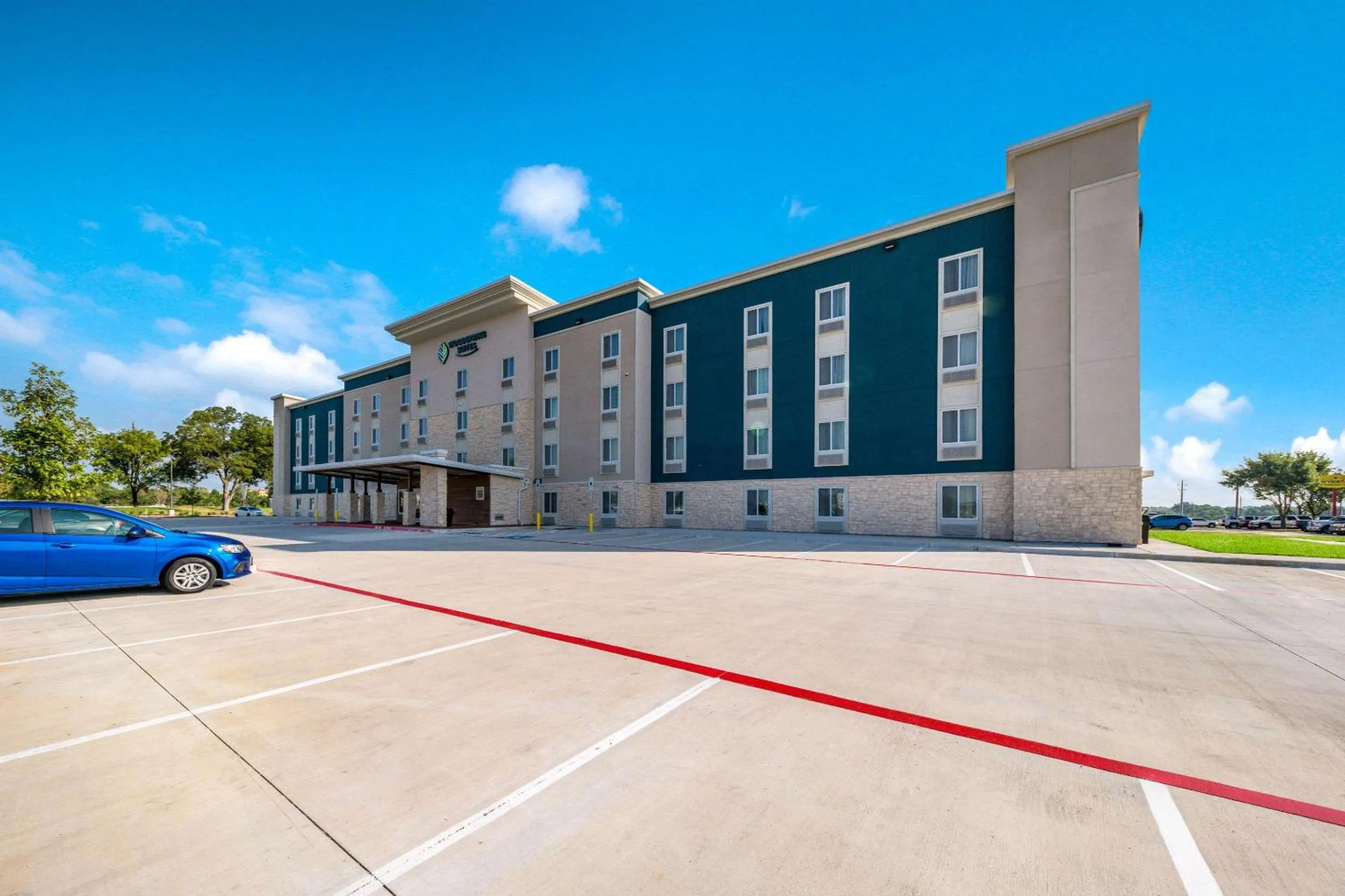 Property building in WoodSpring Suites Dallas Plano Central Legacy Drive