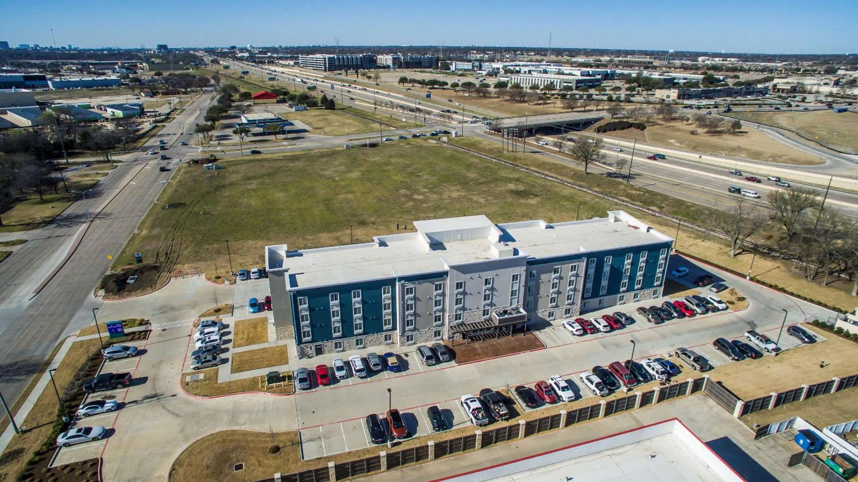 Property building in WoodSpring Suites Dallas Plano Central Legacy Drive