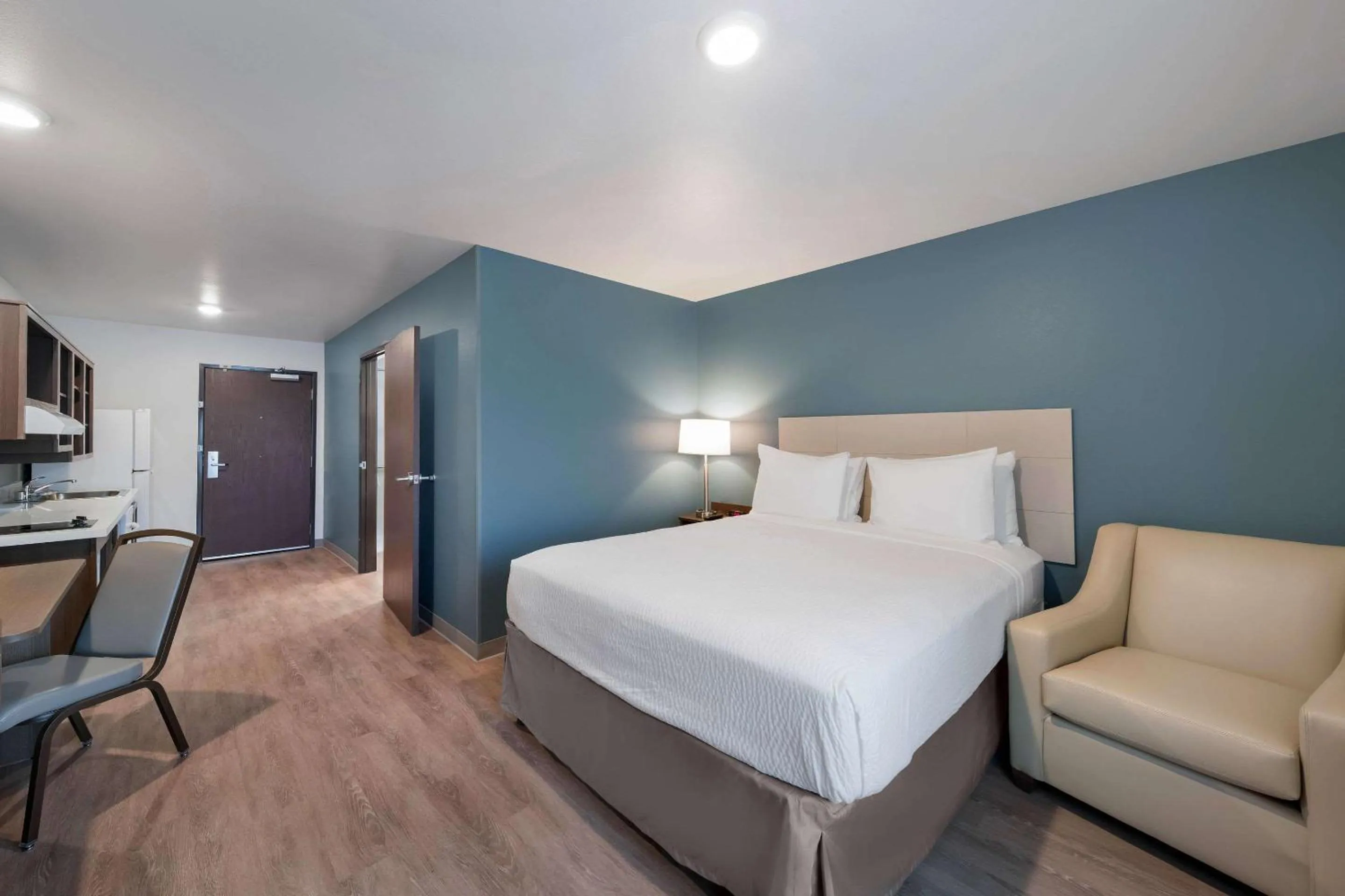 Photo of the whole room, Bed in WoodSpring Suites Dallas Plano Central Legacy Drive