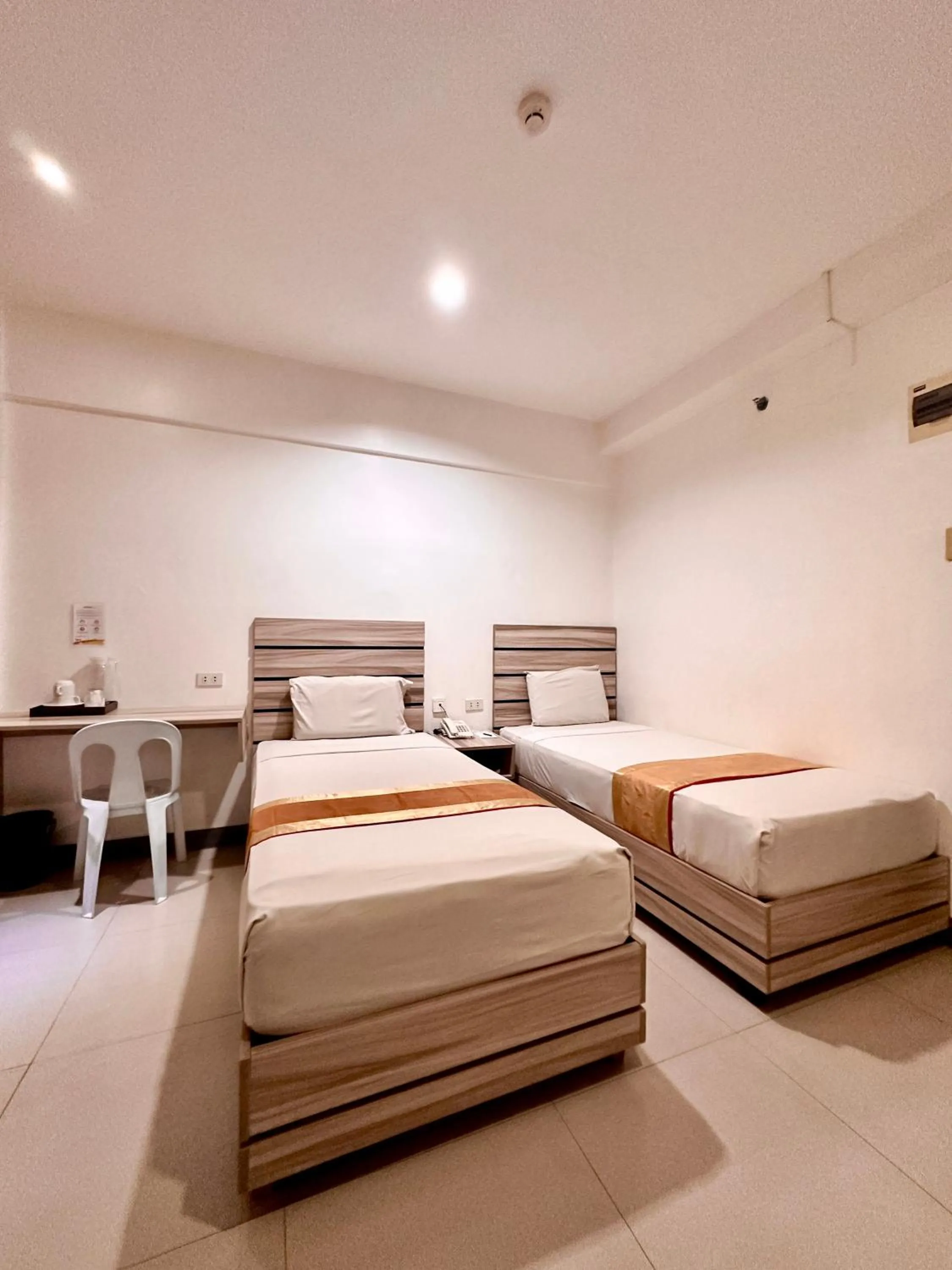 Bed in Travelbee Fuente Inn