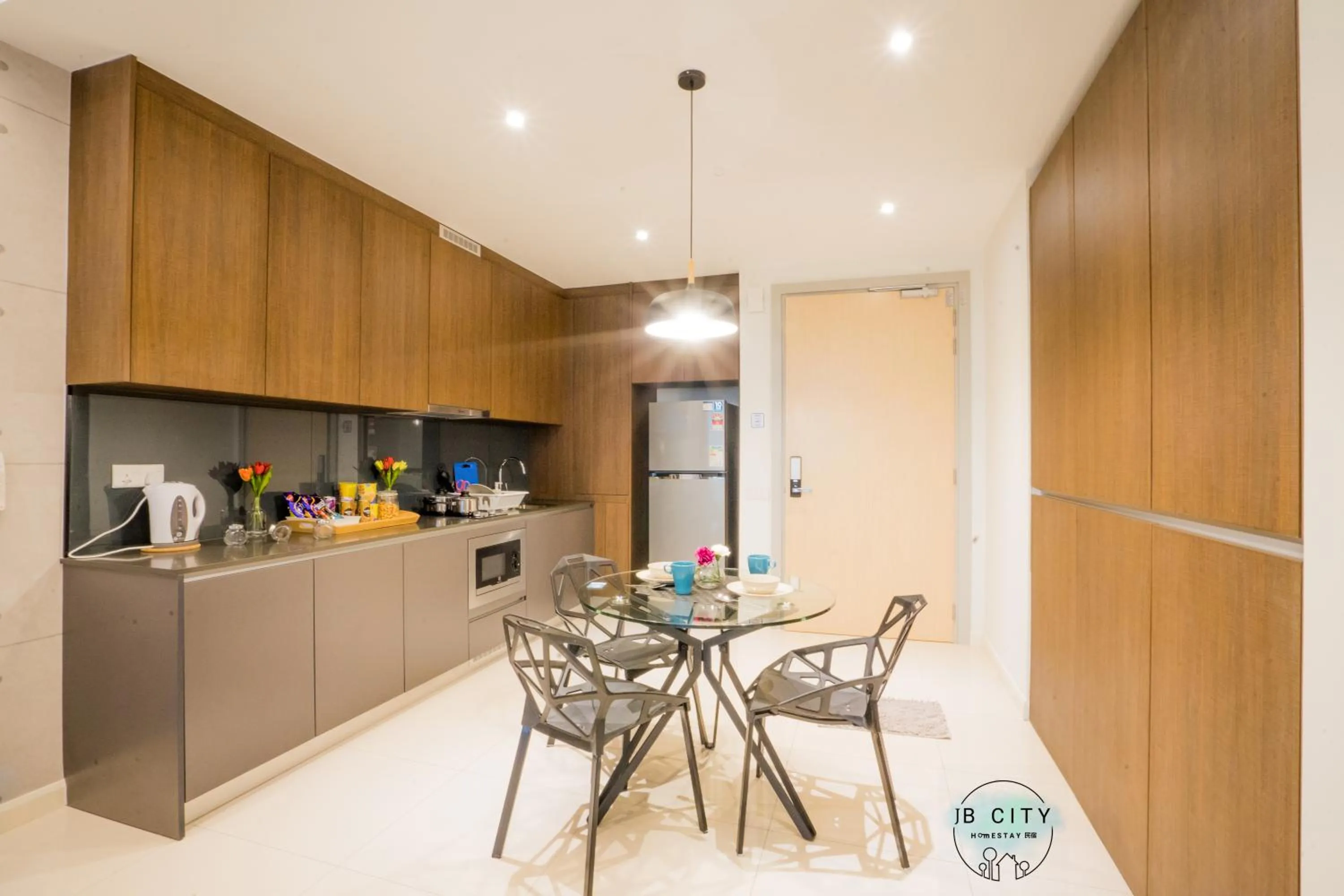 Kitchen or kitchenette in Grand Medini Suites by RR JBcity