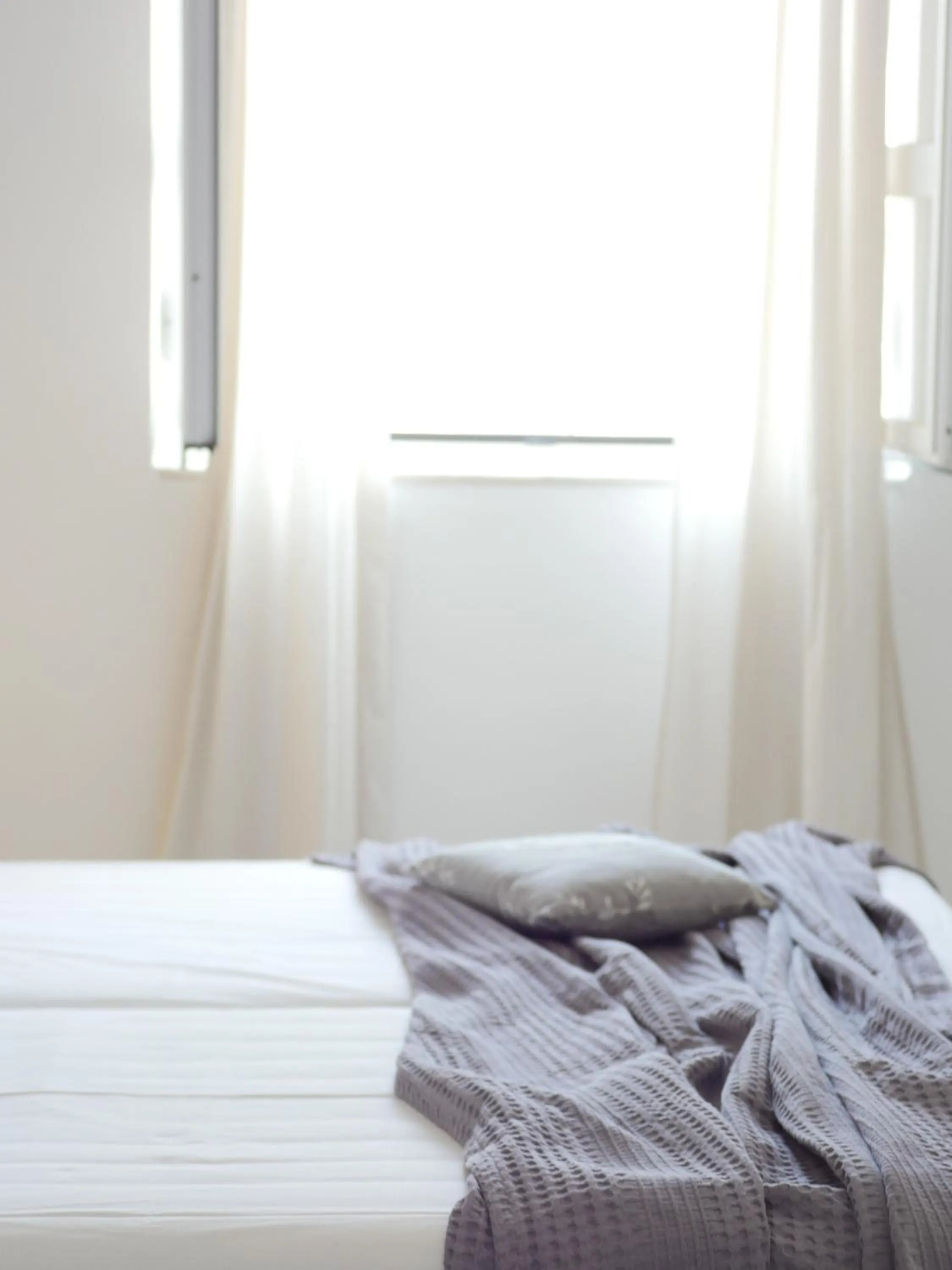 Bed in Galini Rooms & Apartments