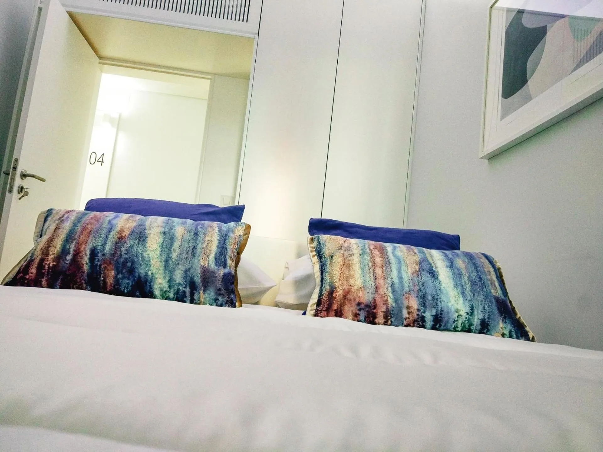 Bed in NLC Rooms & Suites