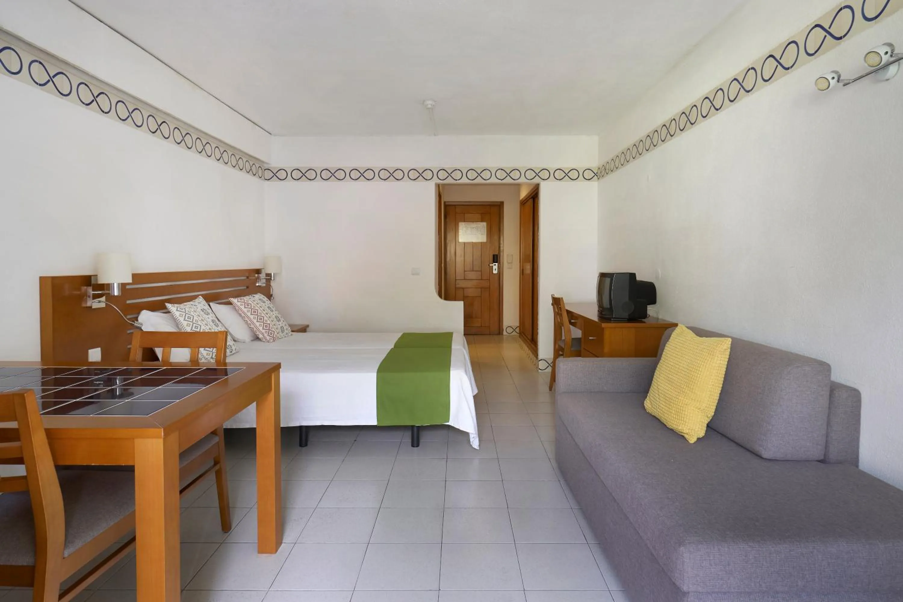 Seating area, Bed in Golden Club Cabanas