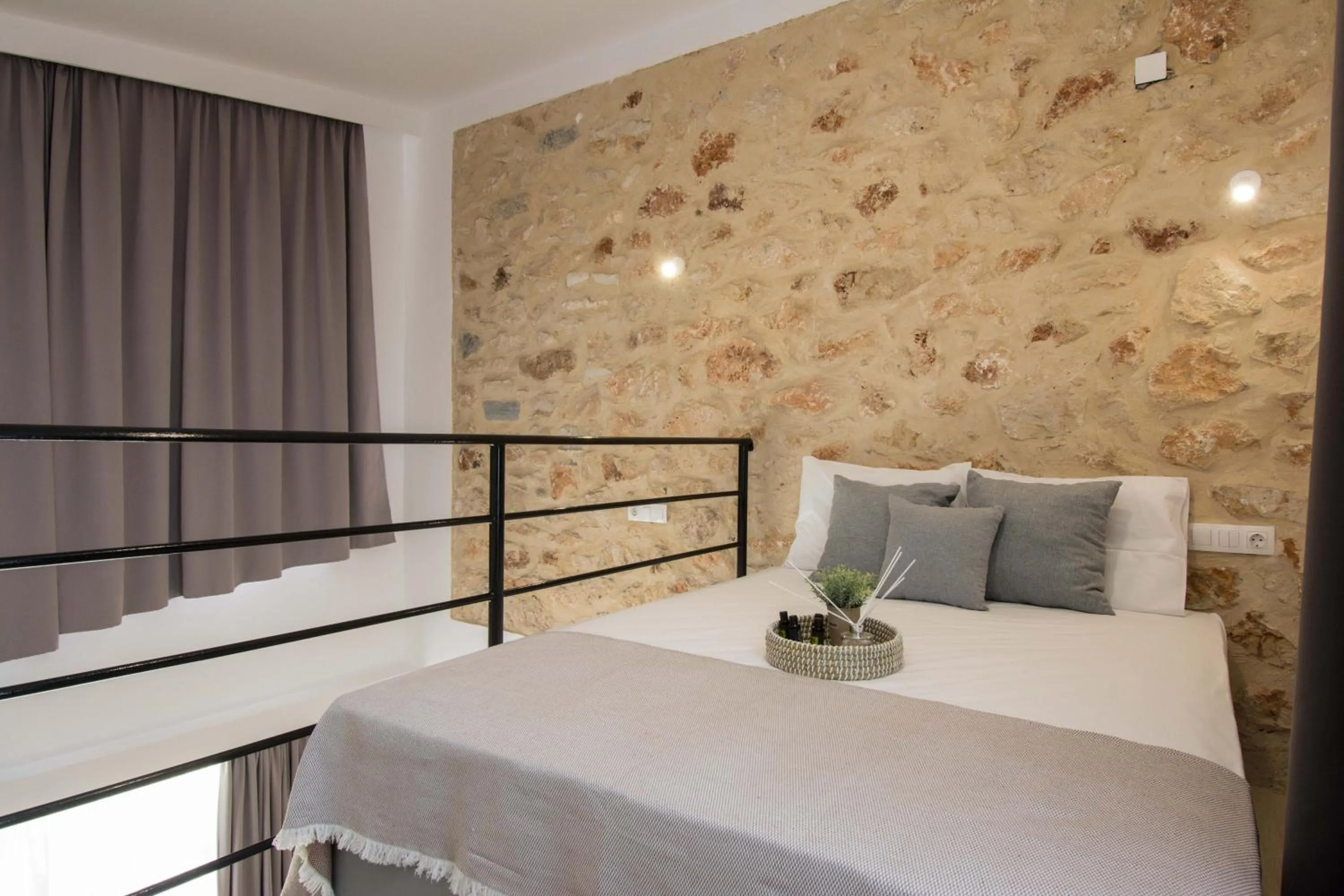 Bed in Michalianna Suites "by Checkin"