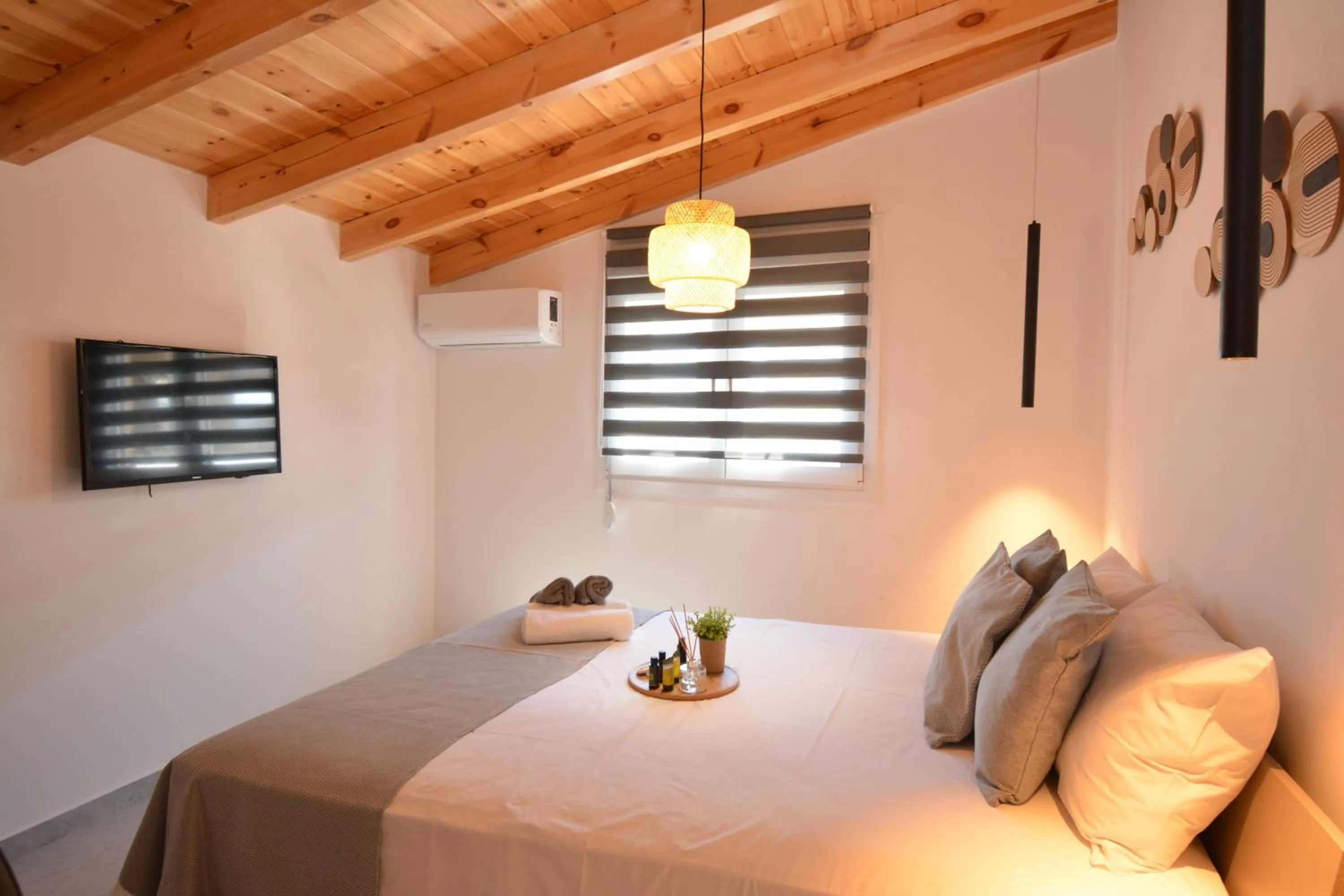 Bed in Michalianna Suites "by Checkin"