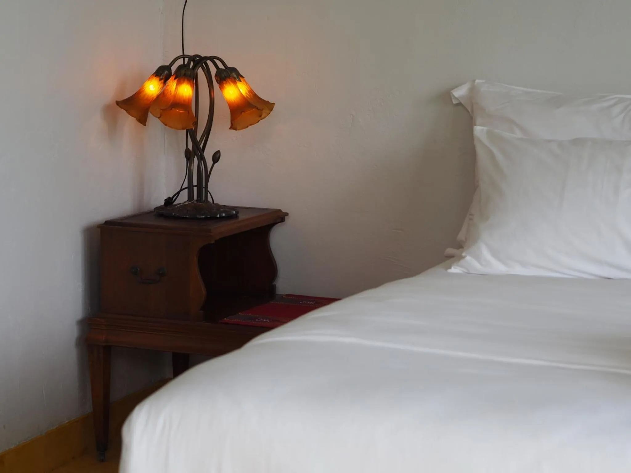 Bed in BaanSuk Sukhothai Resort