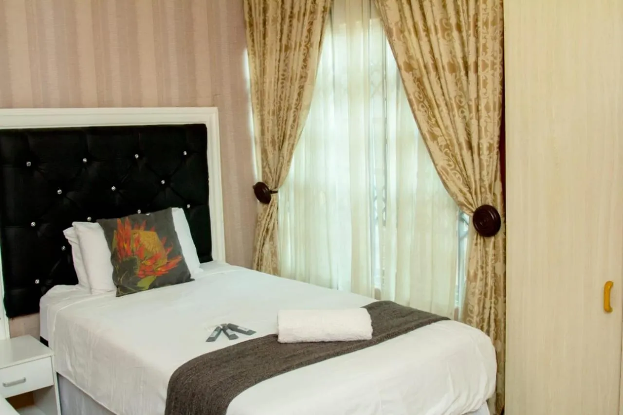 Bed in Vakhusi Guesthouse