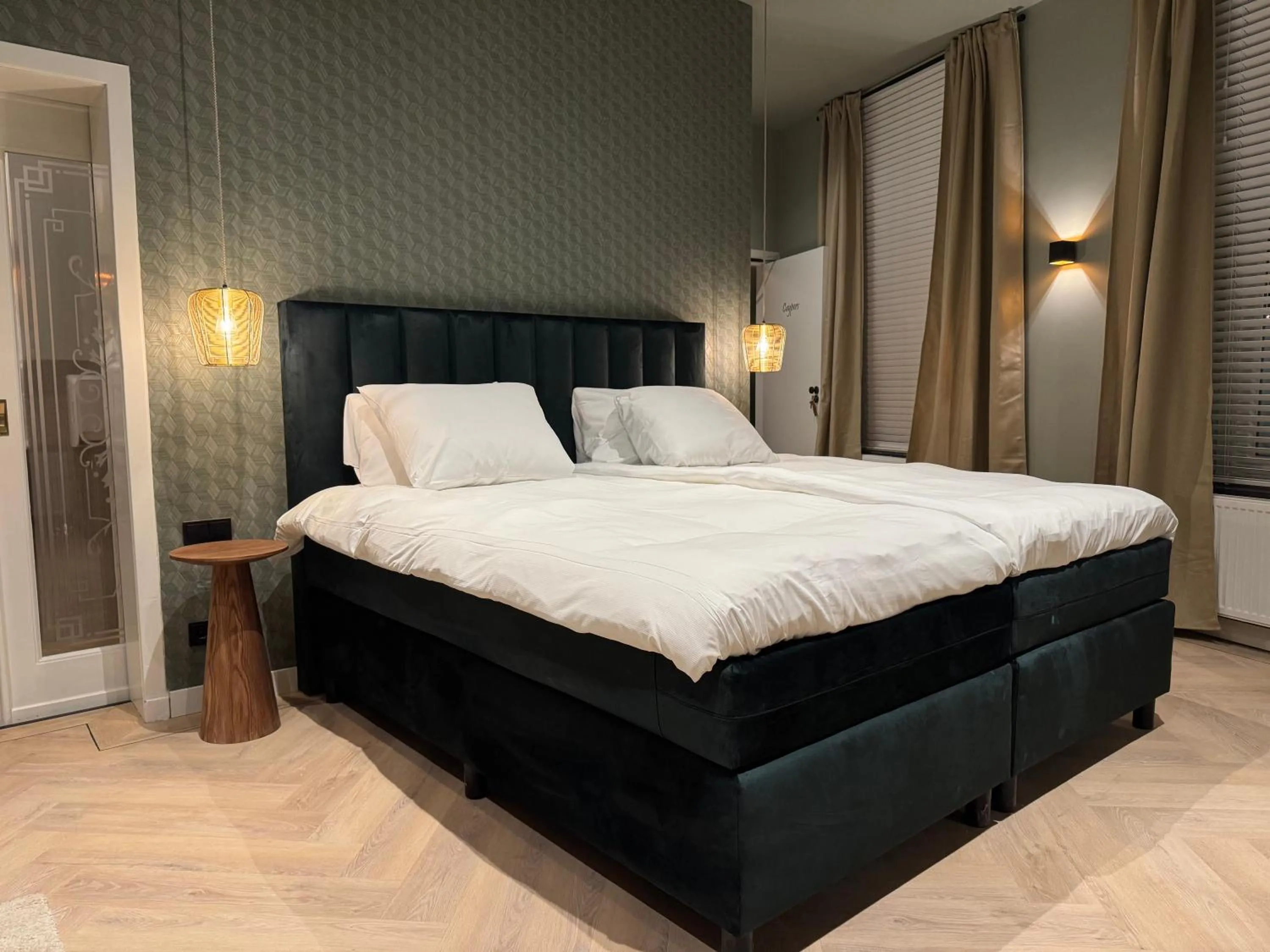 Bed in De Pastorie Bed & Breakfast