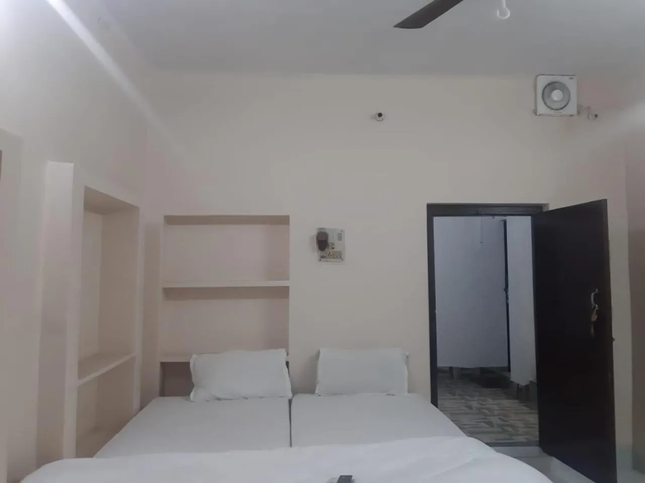 Photo of the whole room, Bed in Sita Inn Home Stay Away From Home By Hotel Sita Varanasi