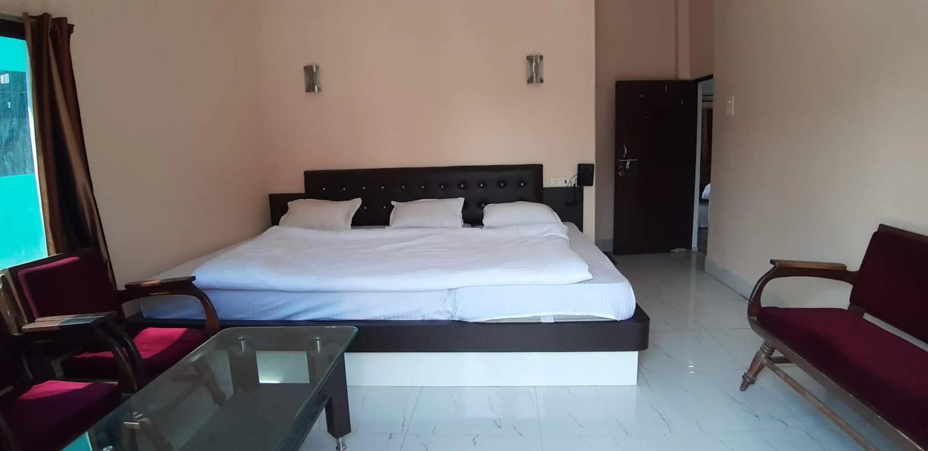 Photo of the whole room, Bed in Sita Inn Home Stay Away From Home By Hotel Sita Varanasi
